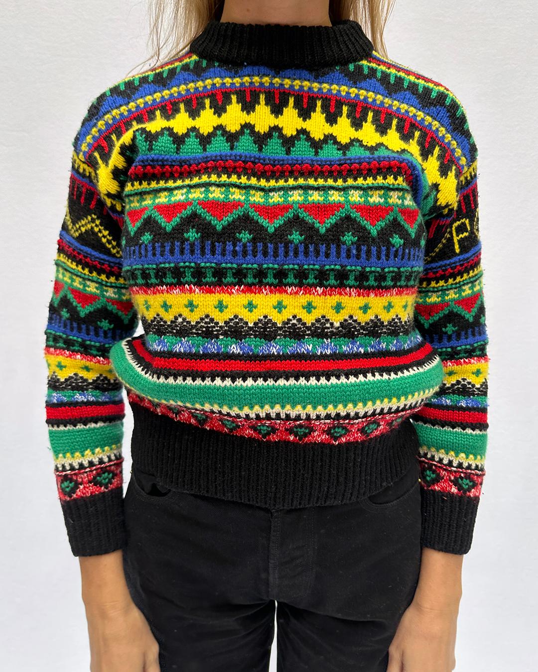 Vintage Polo Ralph Lauren Fair Isle Cashmere/Wool Sweater: Vintage Polo Ralph Lauren sweaters are becoming increasingly sought-after and collectible, and this bright piece is no exception. It features a vibrant, colorful fair isle print, in a very