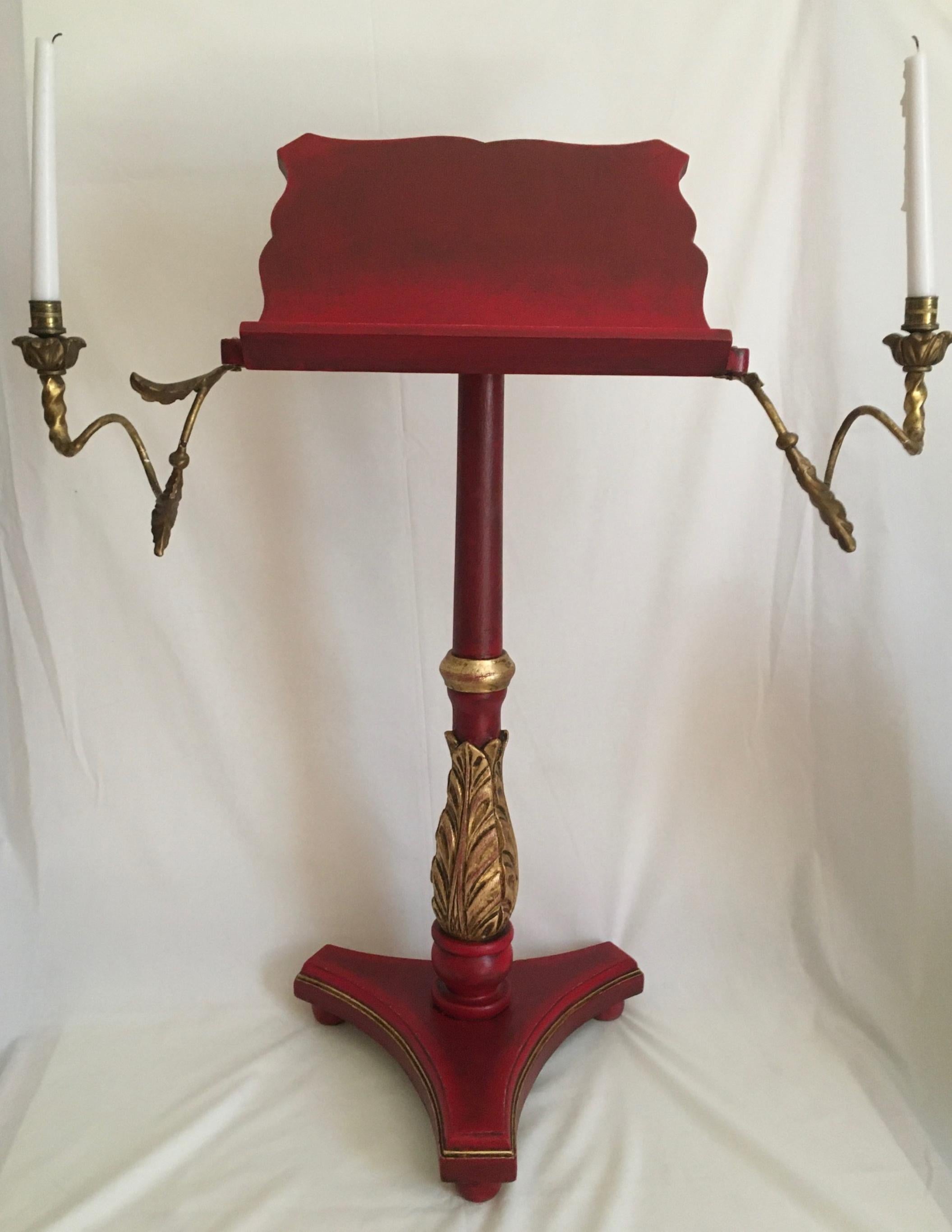 Vintage polychrome and gilded Venetian music stand.

Baroque style gilded, carved and polychrome music stand. The stand or lectern has a scalloped top over carved baluster column supported on a tripod base. Two wood carved and gilded candle