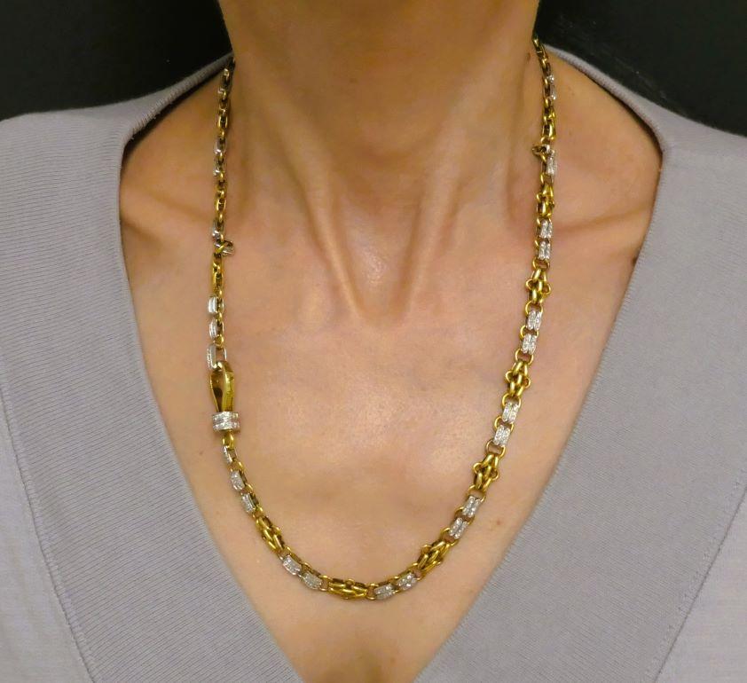 A chic and elegant Pomellato diamond chain necklace made of 18k white and yellow gold.
The chain has a whimsical link that comprises rhombus-like yellow gold details alternated with the horizontal white gold planks adorned with diamonds. These two
