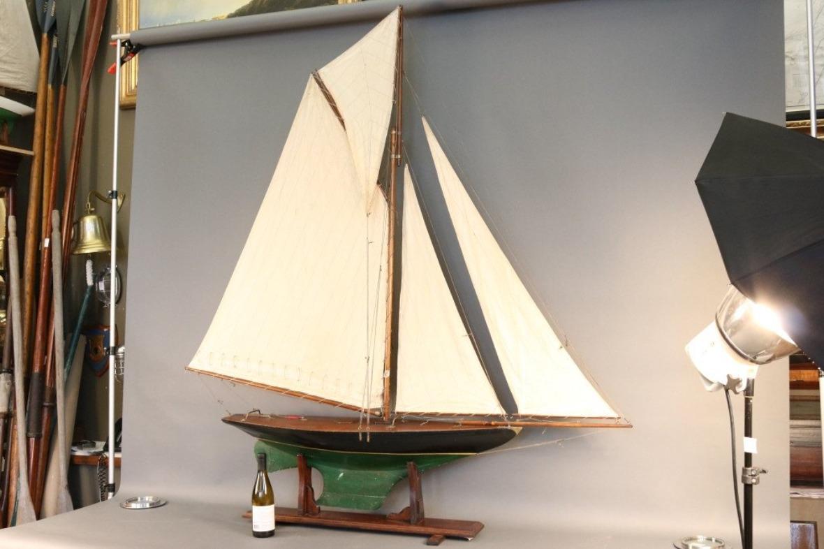 Vintage pond yacht with painted hull, black over green, varnished deck, full suit of cotton sails. Easy to break down rig and set up. We will disassemble for you.

Overall dimensions: 73 1/2