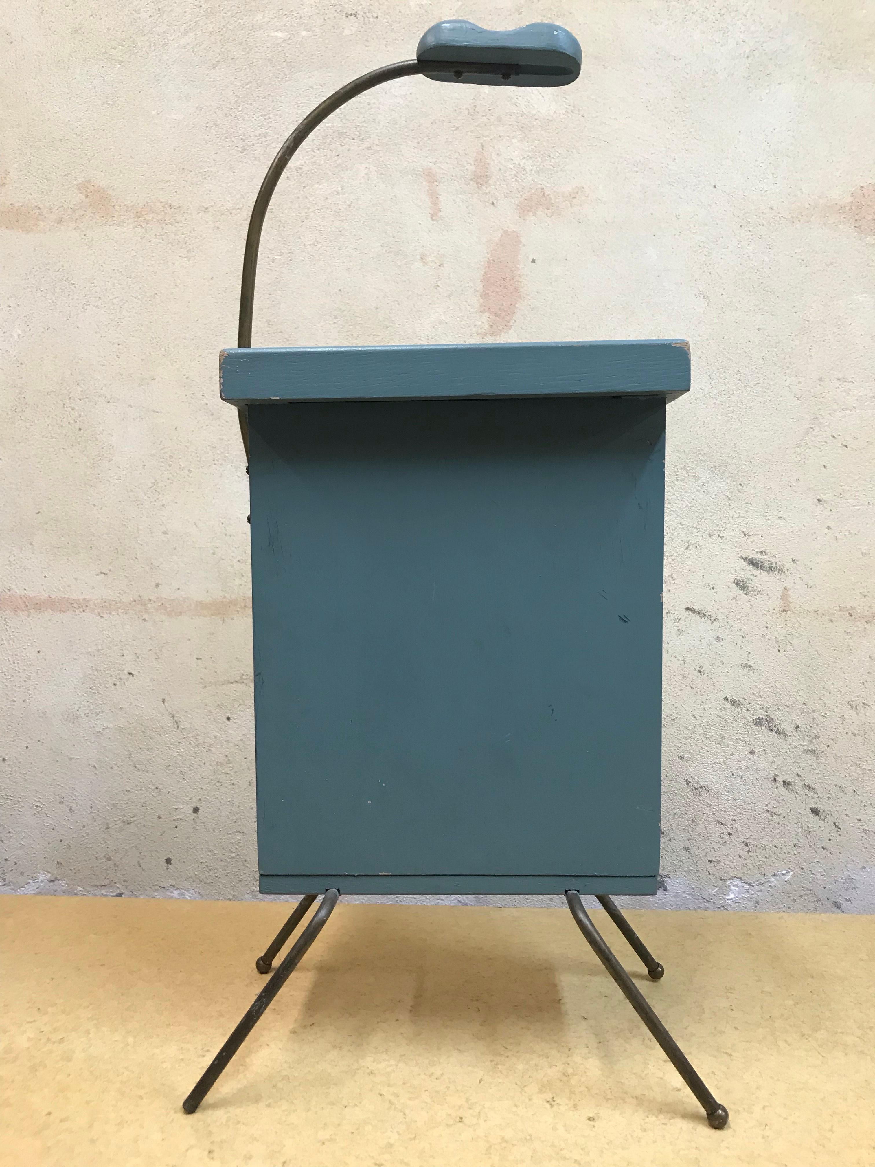 Vintage phone stand, simple and charming, clean lined with a nod to atomic style. A wood handle for mobility (as long as your chord) and storage for your vintage phone book. 

Blue grey, missing one ball 