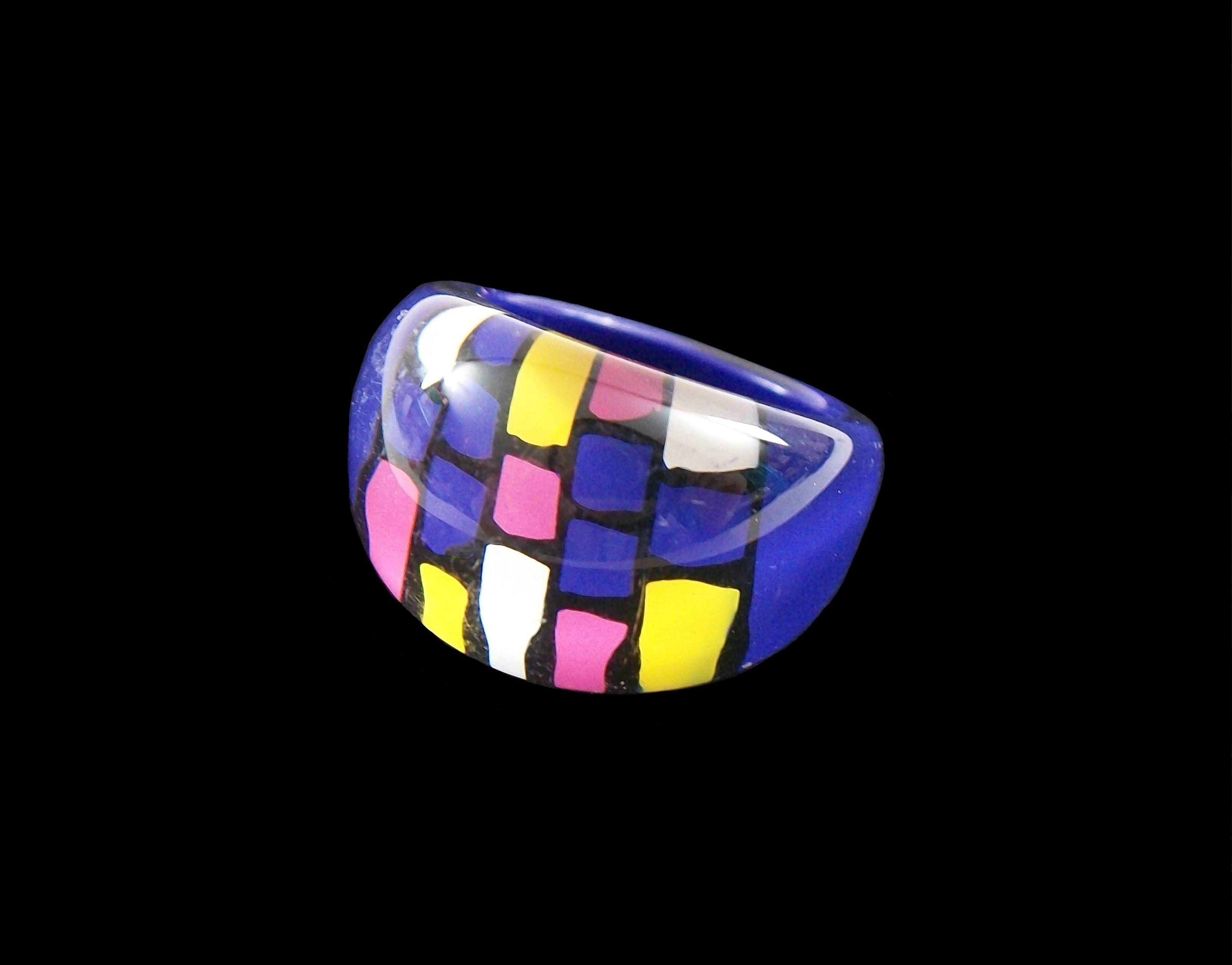 Vintage Pop Art back painted Lucite ring - featuring hand painted multi color squares with a purple background - size 7 3/4 (approximate) - unsigned - late 20th century.

Excellent vintage condition - fine surface scratches from age and use - no