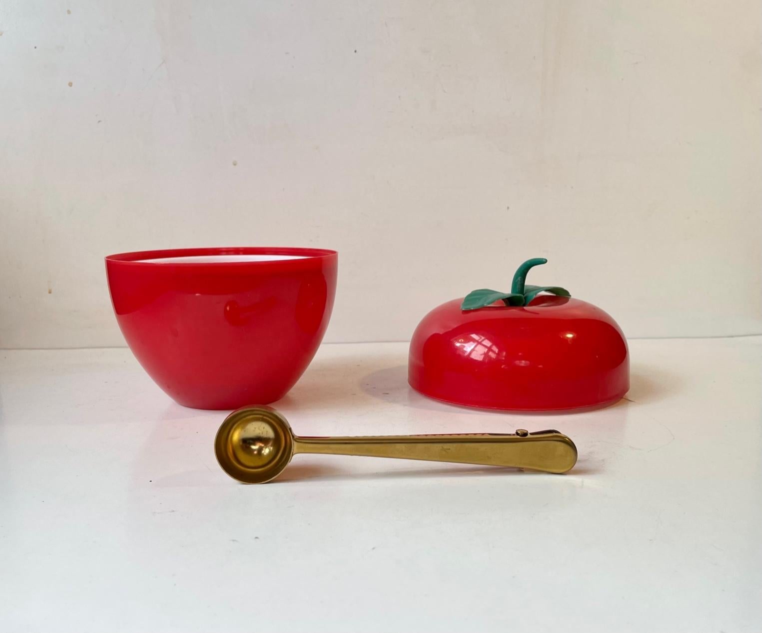 1970s Hong Kong made pop art ice bucket in the shape of a large red apple. Its made from plastic and features white thermos and a tong/spoon is brass alloy aluminum. Measurements: H: 19 cm, D: 15.5 cm.
