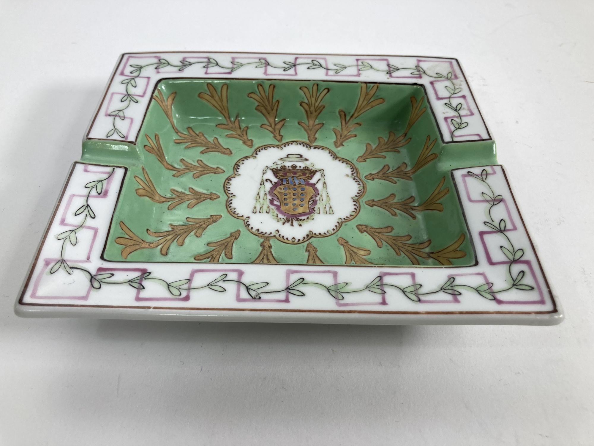 Vintage Porcelain ashtray white and green with coat of arms.
Hand-painted, 1980s
White porcelain with green design in relief..
Very good condition.
Measures: 7.5” W x 6.5” x 1.5