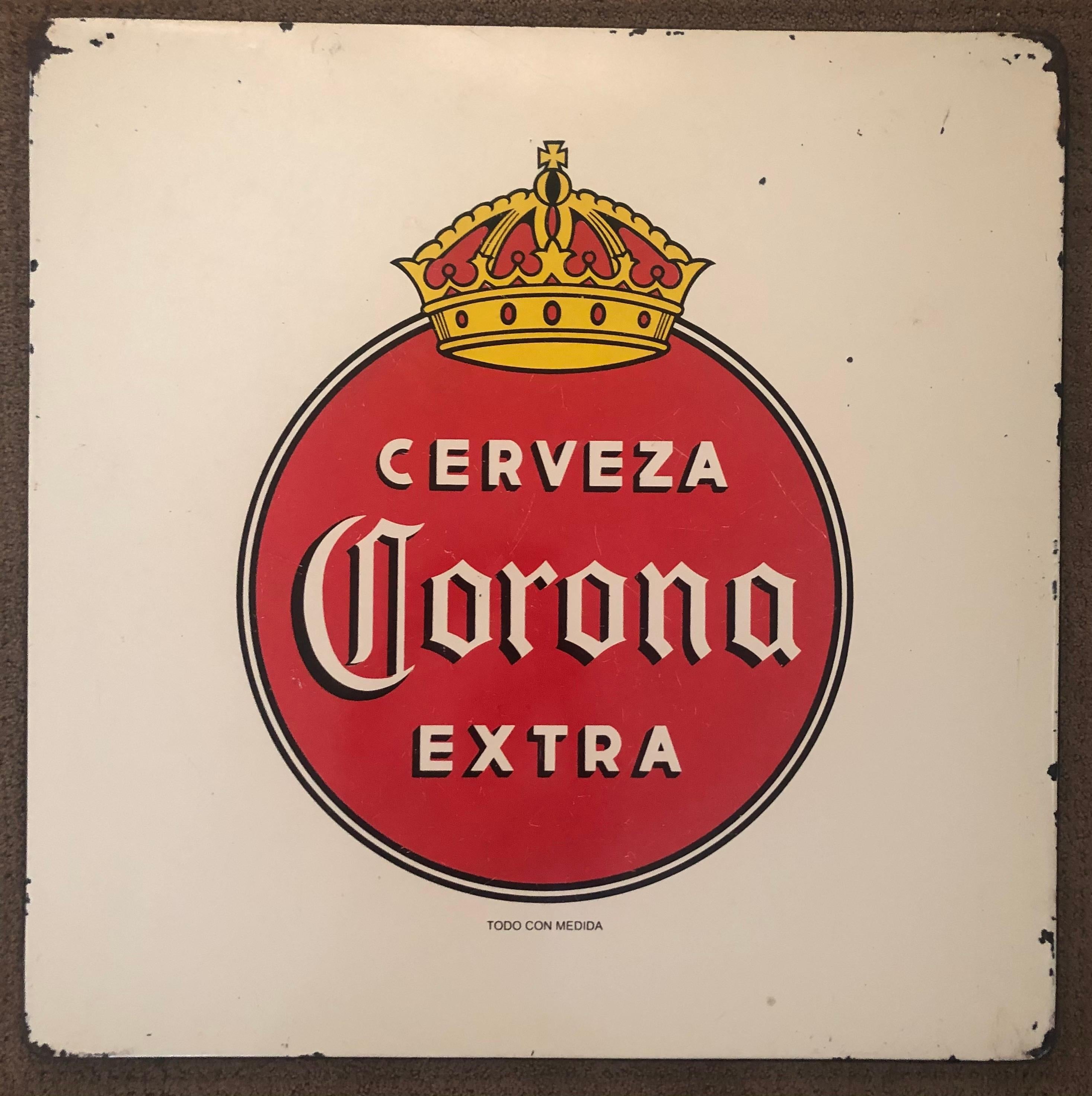 Super cool and hard to find vintage porcelain Corona beer sign, circa 1970s. The sign is actually a former tabletop at a roadside cantina in Mexico. The distressed look and vintage patina make this piece a great addition to any bar or game room! The