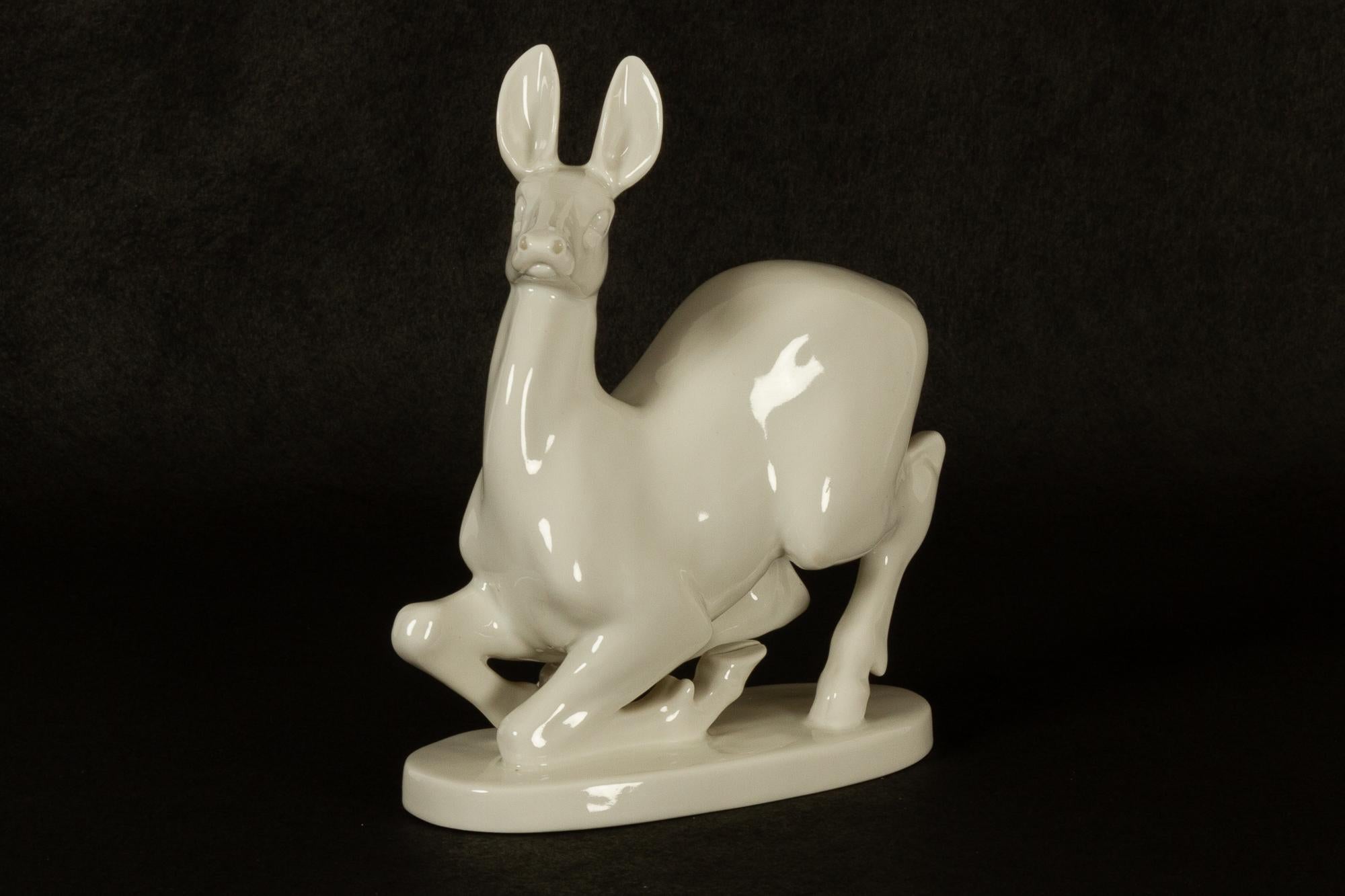 Vintage porcelain deer figurine by Lomonosov.
White glazed porcelain figurine designed by Russian artist Lomonosov and made in St. Petersburg in the 1960s-1970s. Measures: Height 24 cm. USSR red stamp.
Very good condition. No chips or cracks.
