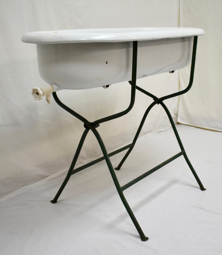 Vintage Porcelain Enamel Baby Bath on Folding Wrought Iron Stand at