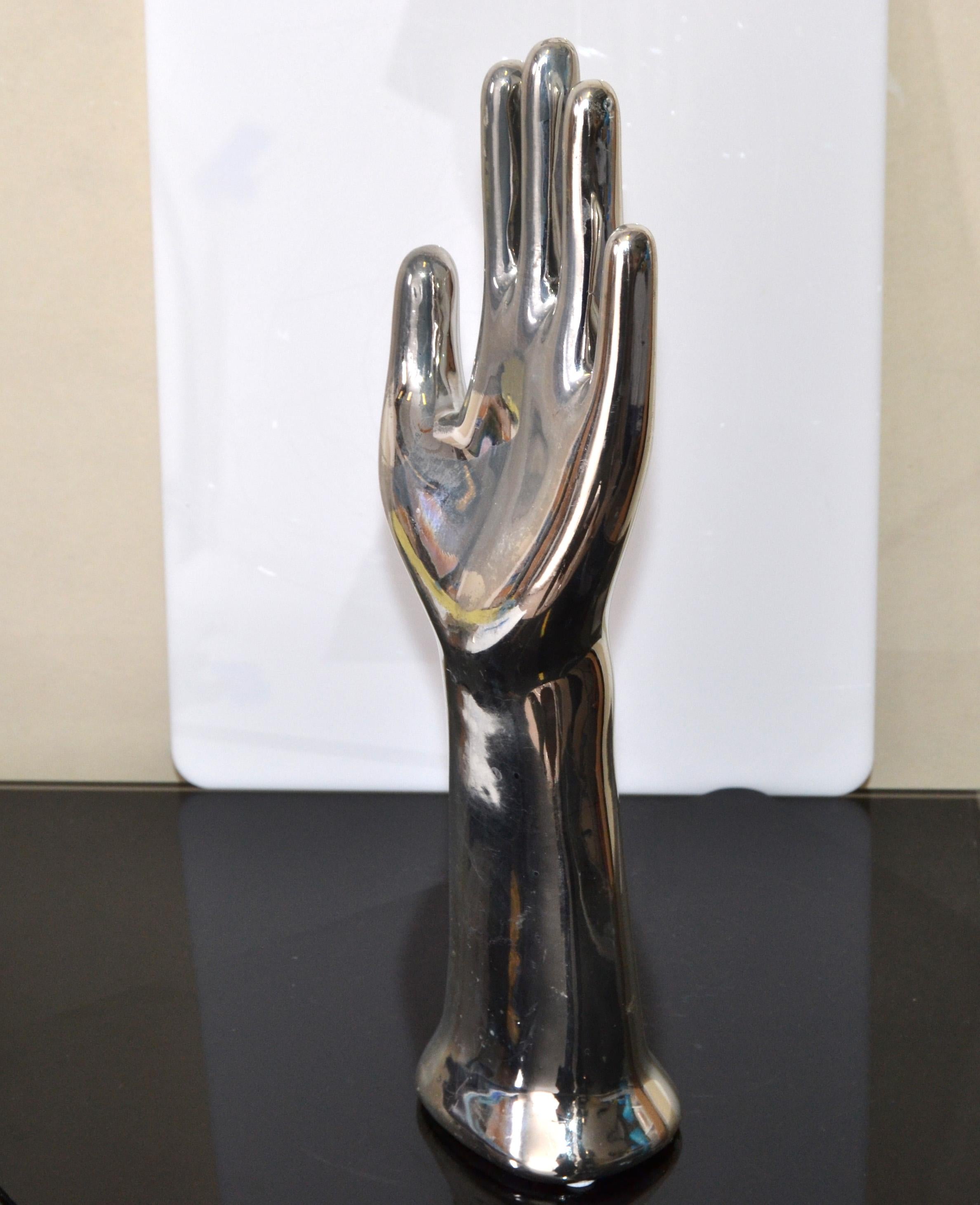 Mid-Century Modern Hand Glove Mold with Nickel Plated Finish and made out of Porcelain.
Looks great as Sculpture or can be used as Jewlery Stand, Jewlery Holder.
 