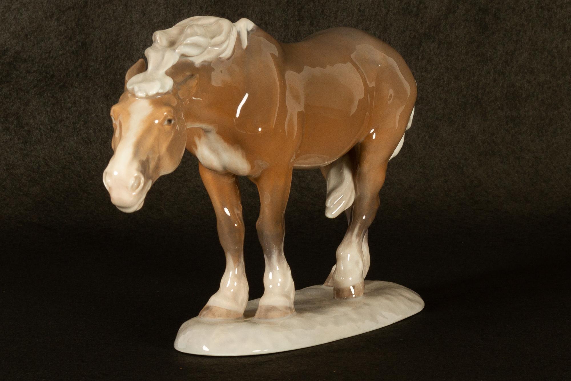 Vintage porcelain horse figurine by Lauritz Jensen for Royal Copenhagen 1968.
Rare figurine designed by Lauritz Jensen in 1912. Made Royal Copenhagen in 1968.
Marked with Royal Copenhagen stamp and model number 1362.
1. factory quality, no flaws