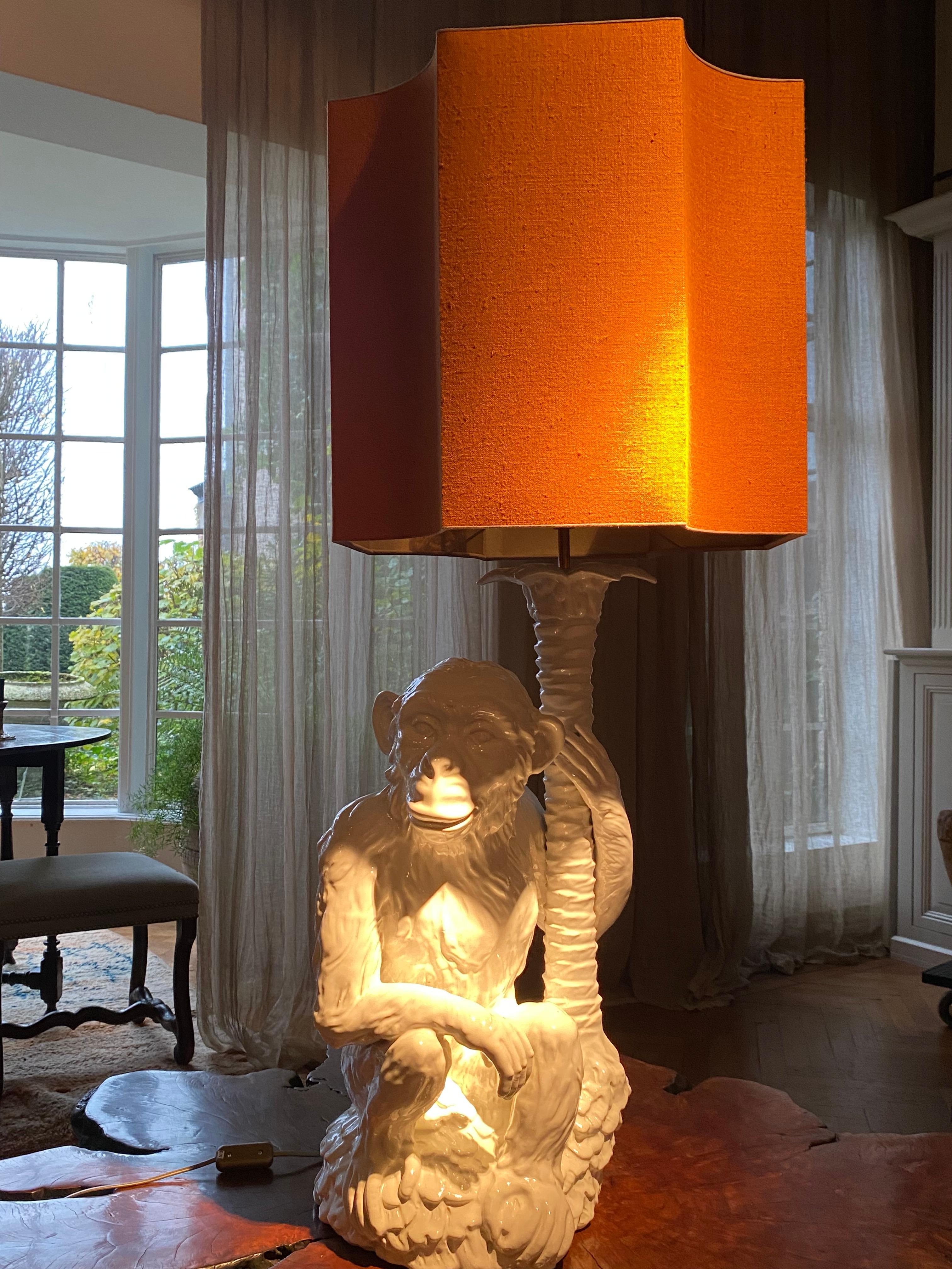Exceptional Tablelamp, Monkey seated at a tree,
White Porcelain in a mint condition,
very decorative object,
new shade made in an Orange Fabric,
Shade is 45 cm high x 43 cm wide and 43 cm deep