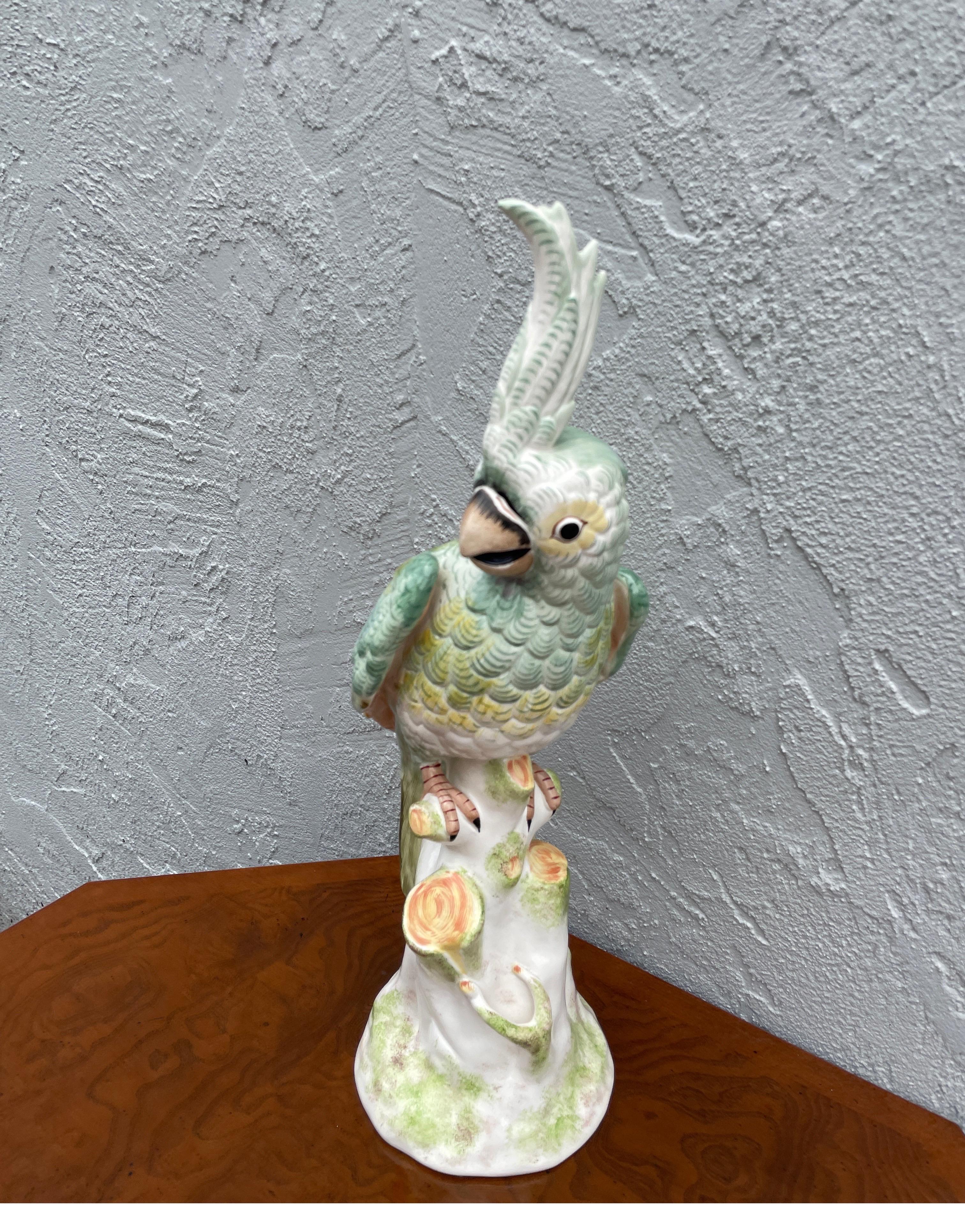 Vintage Italian porcelain parrot figurine by Paul Hanson.