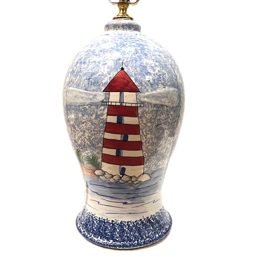A circa 1980's French porcelain light house table lamp.

Measurements:
Height of body: 14.5