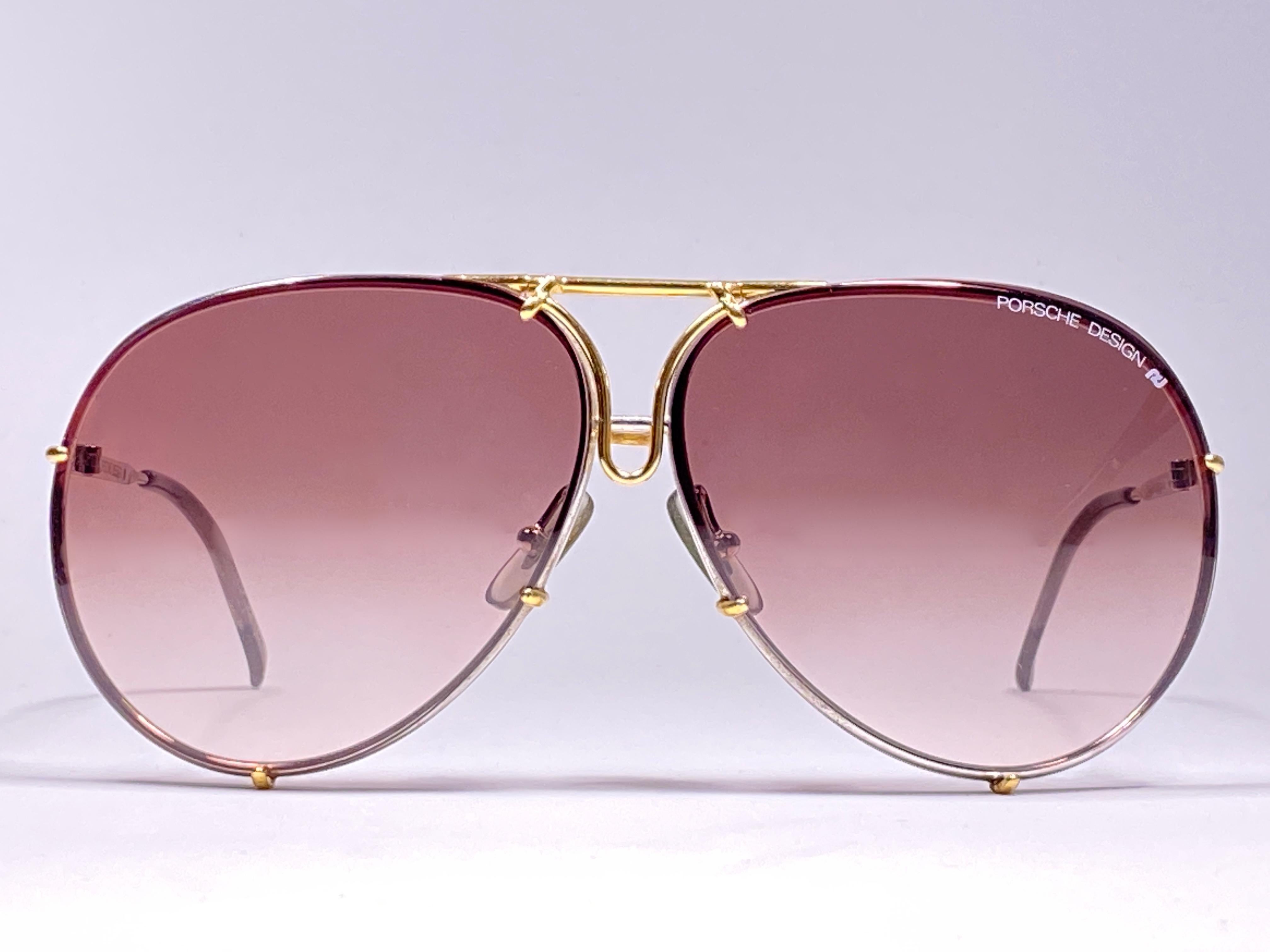 Ultra rare collectors item from the 1980's, 30 years old. 

Porsche Design 5623 gold & silver frame with brown gradient lenses.  Amazing craftsmanship and quality.  No extra pair of lenses for this pair.  This pair has light of wear due to