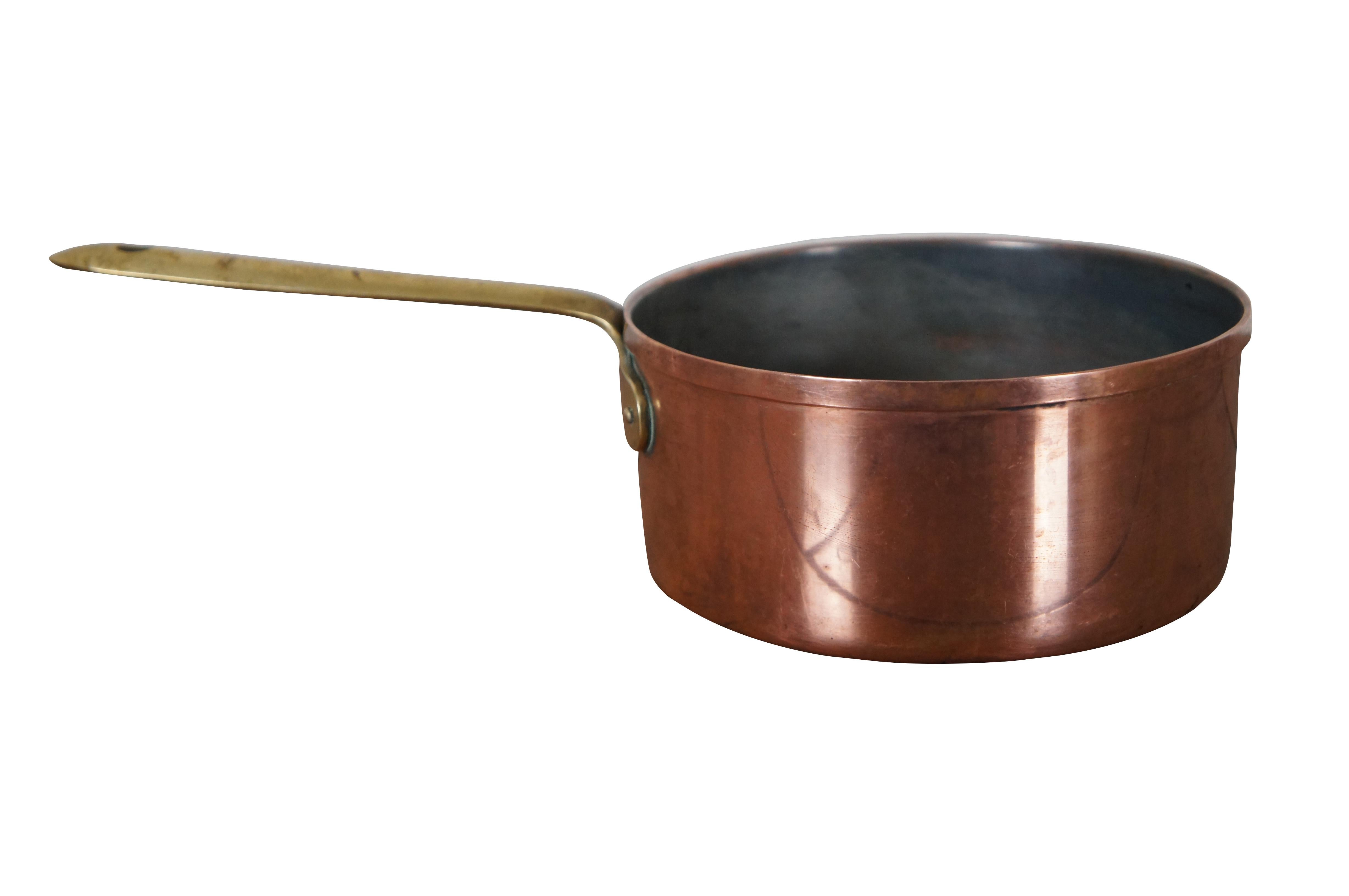 Vintage Portugese copper sauce pot with brass handle.  Made in Portugal.

Dimensions:
13.5” x 6.75” x 3.5” (Width x Depth x Height)
