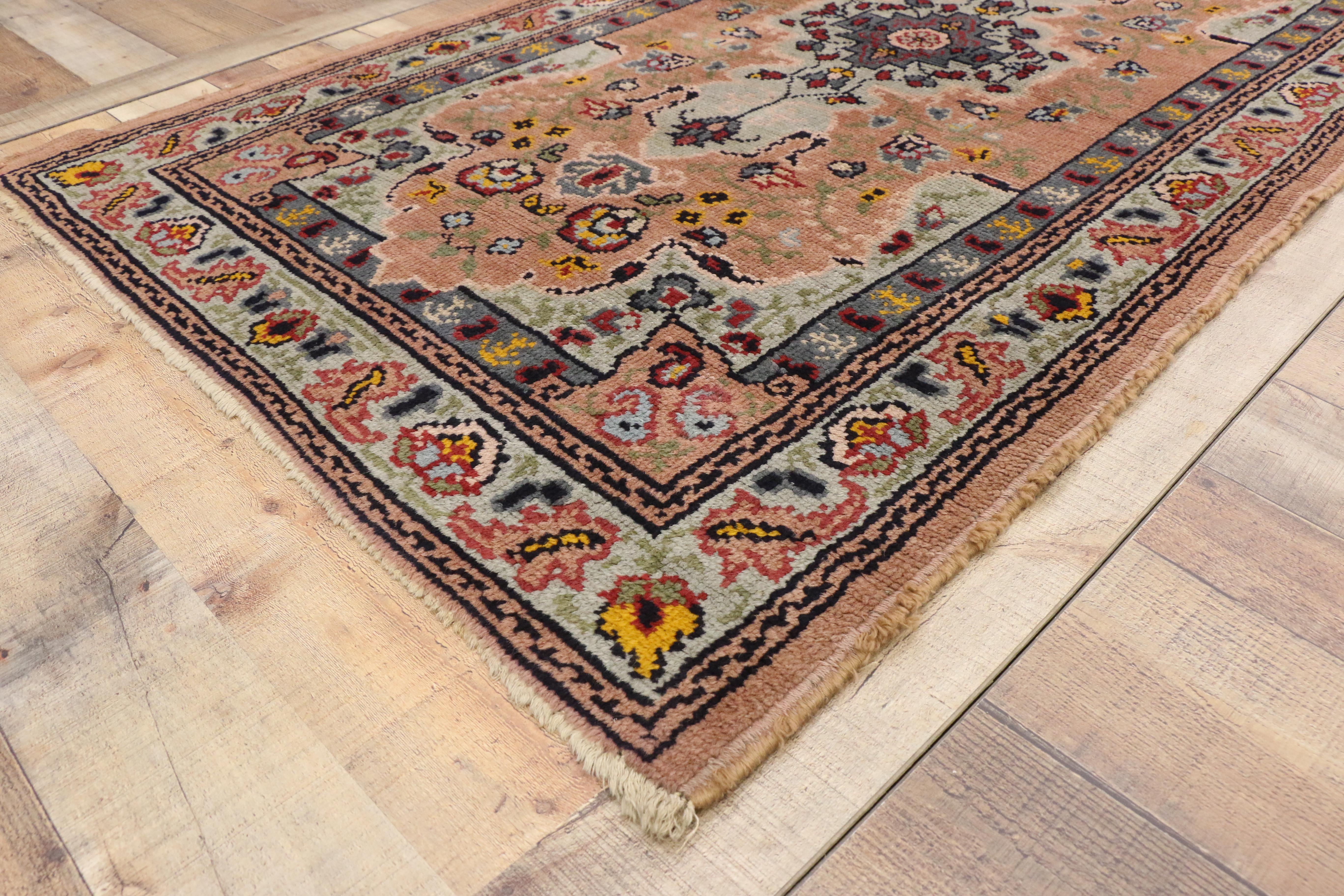76876, vintage Portuguese Accent rug with traditional style. This delightful vintage Portuguese rug features a muted pale sky blue medallion with red florals on a salmon field. Intricate floral spandrels and a pale sky blue floral border frame the