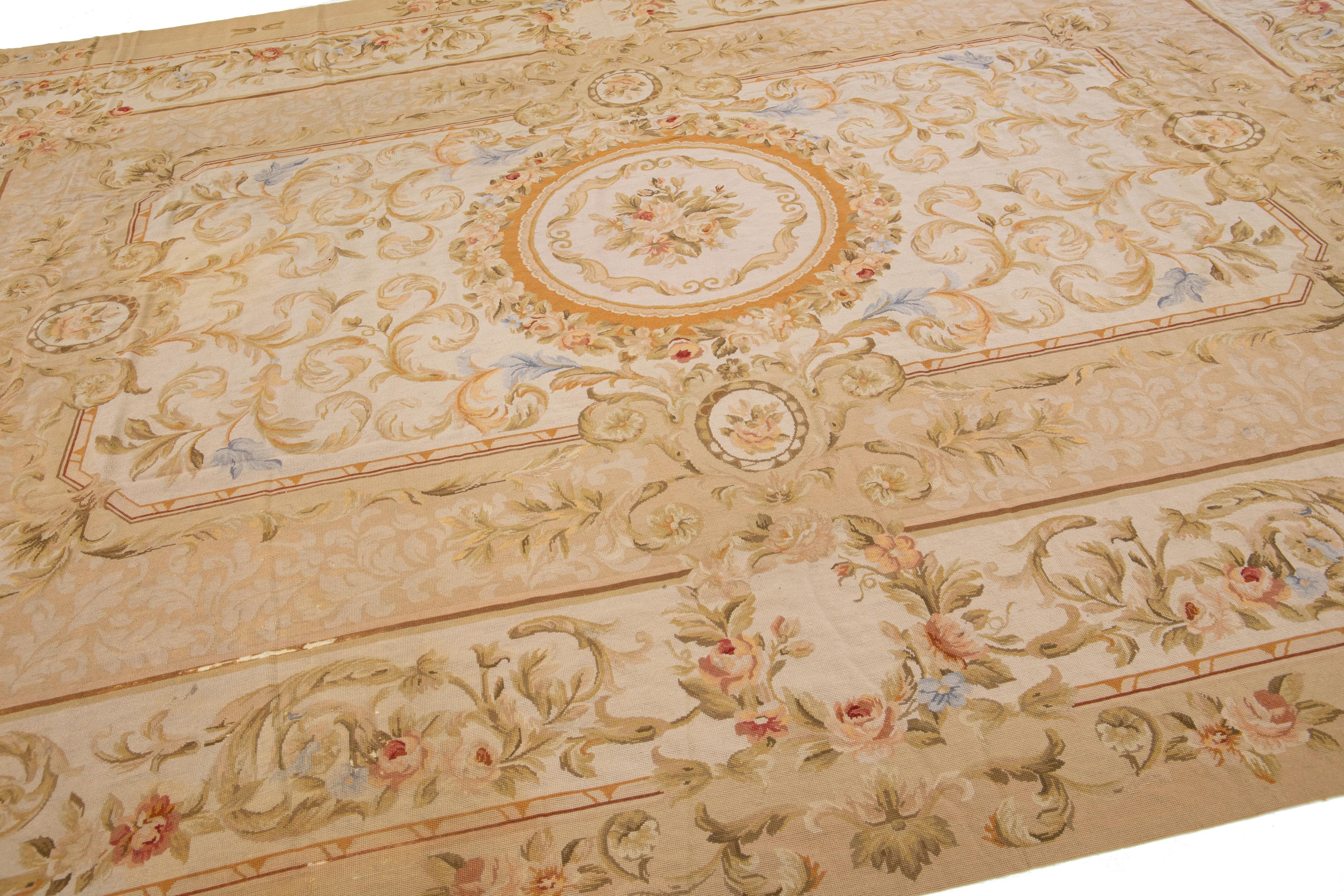 Vintage Portuguese Aubusson Needlepoint Wool Rug In Beige With Rosette Motif In Excellent Condition For Sale In Norwalk, CT