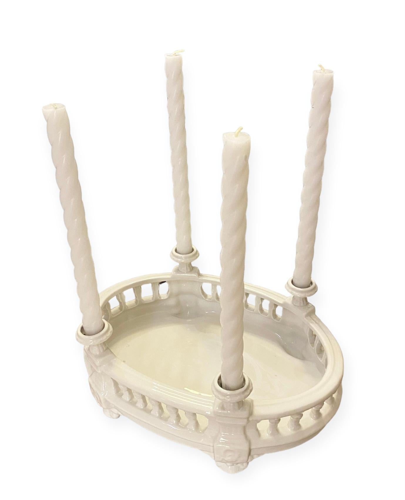 A lovely vintage Portuguese, crème ceramic centerpiece having a balustrade with four vases for candles.