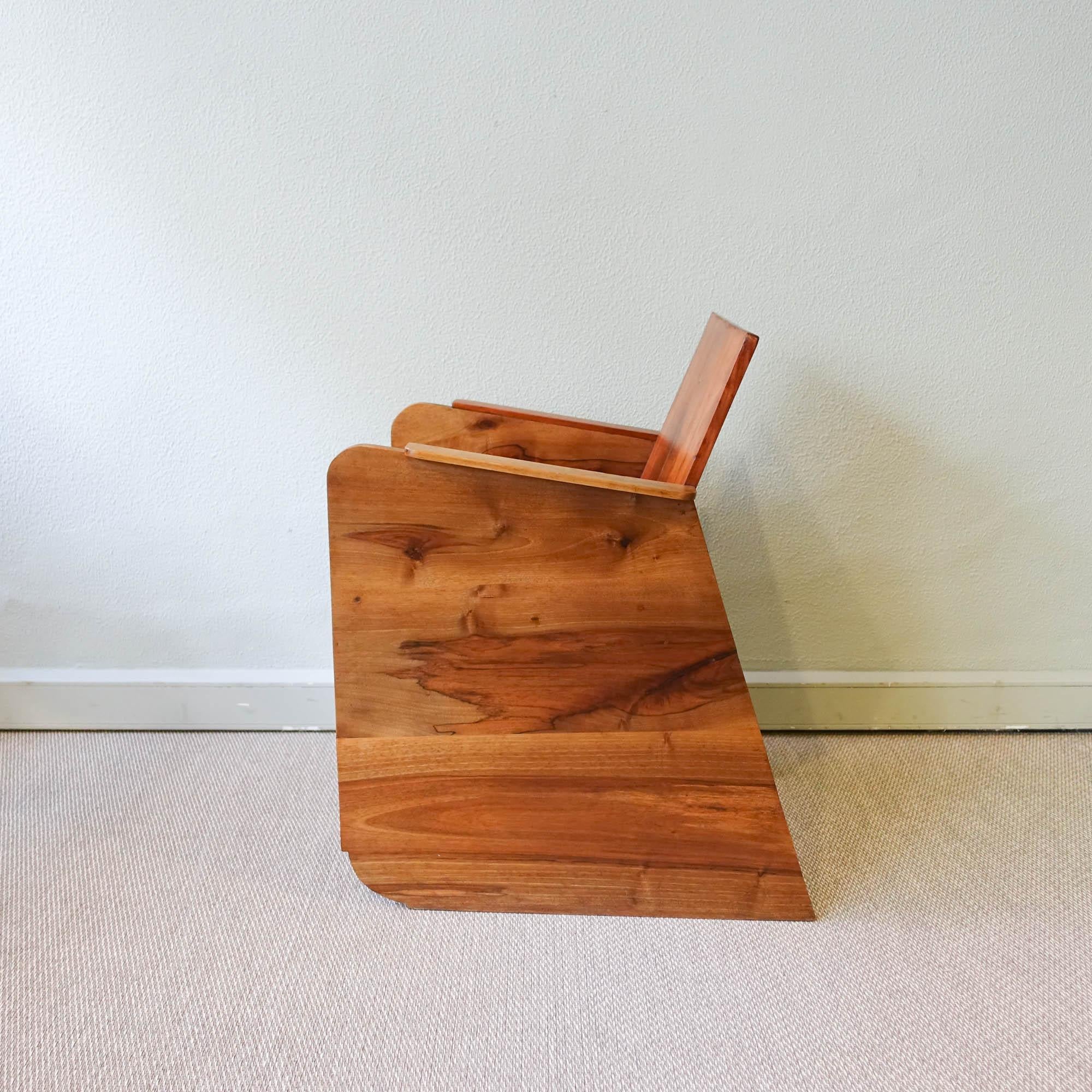 This vintage Constructivist armchair was designed and produced in Portugal, during 1930's. With clean, geometric and streamline shape, it is made of solid pine, cherry wood and walnut and was fully restored. 
“Constructivism was the last and most