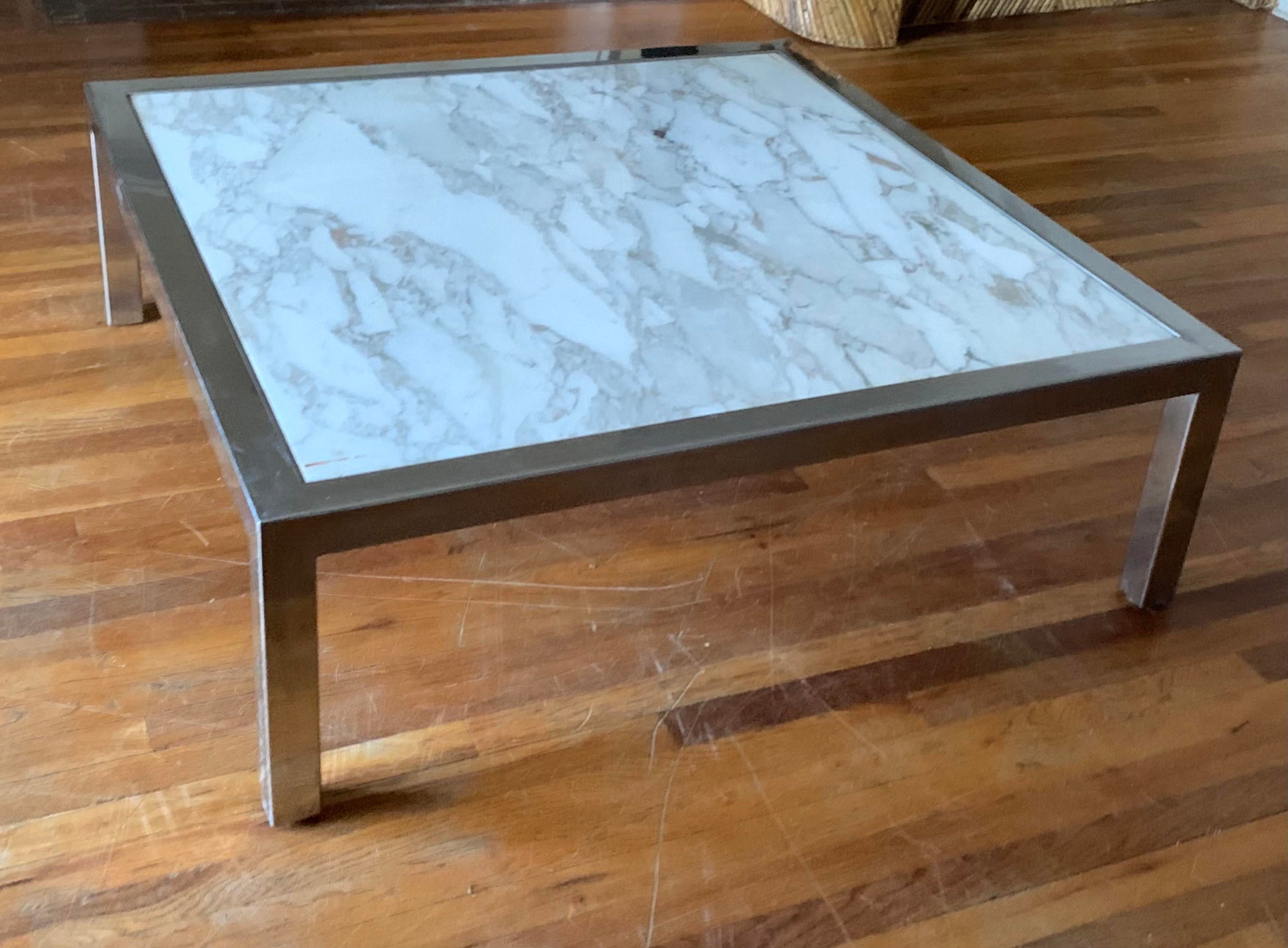 Massive impressive cocktail table

Steel frame is thick & significant.

The removable recessed top is composed of a lovely highly-variegated piece of vintage marble.

The grays that run throughout this piece of stone are on the warmer side,