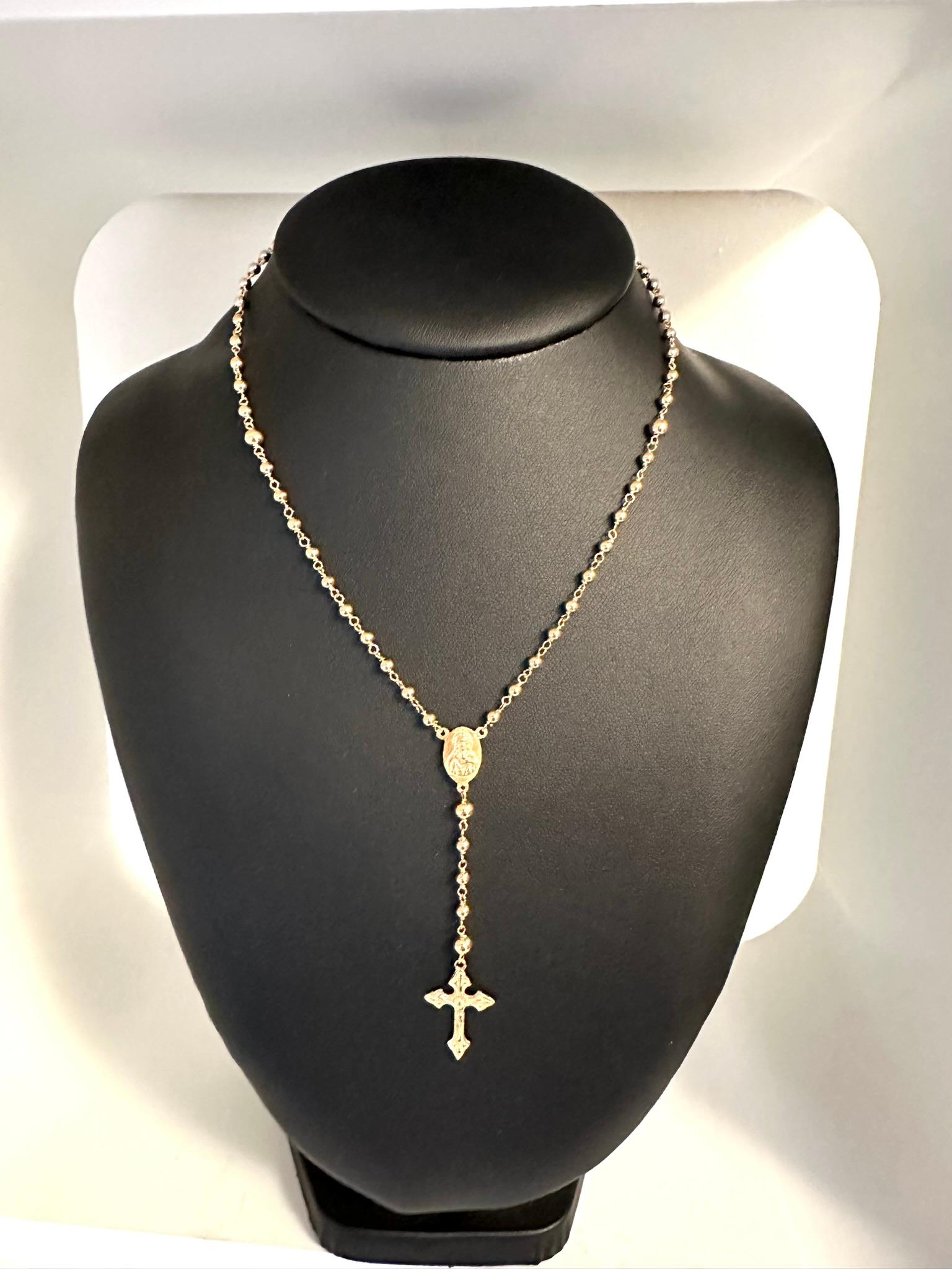 The Vintage Portuguese Rosary in 19 karat Yellow Gold from Fatima is a remarkable religious artifact that holds both cultural and spiritual significance. Originating from Fatima, a renowned pilgrimage site in Portugal, this rosary carries with it a