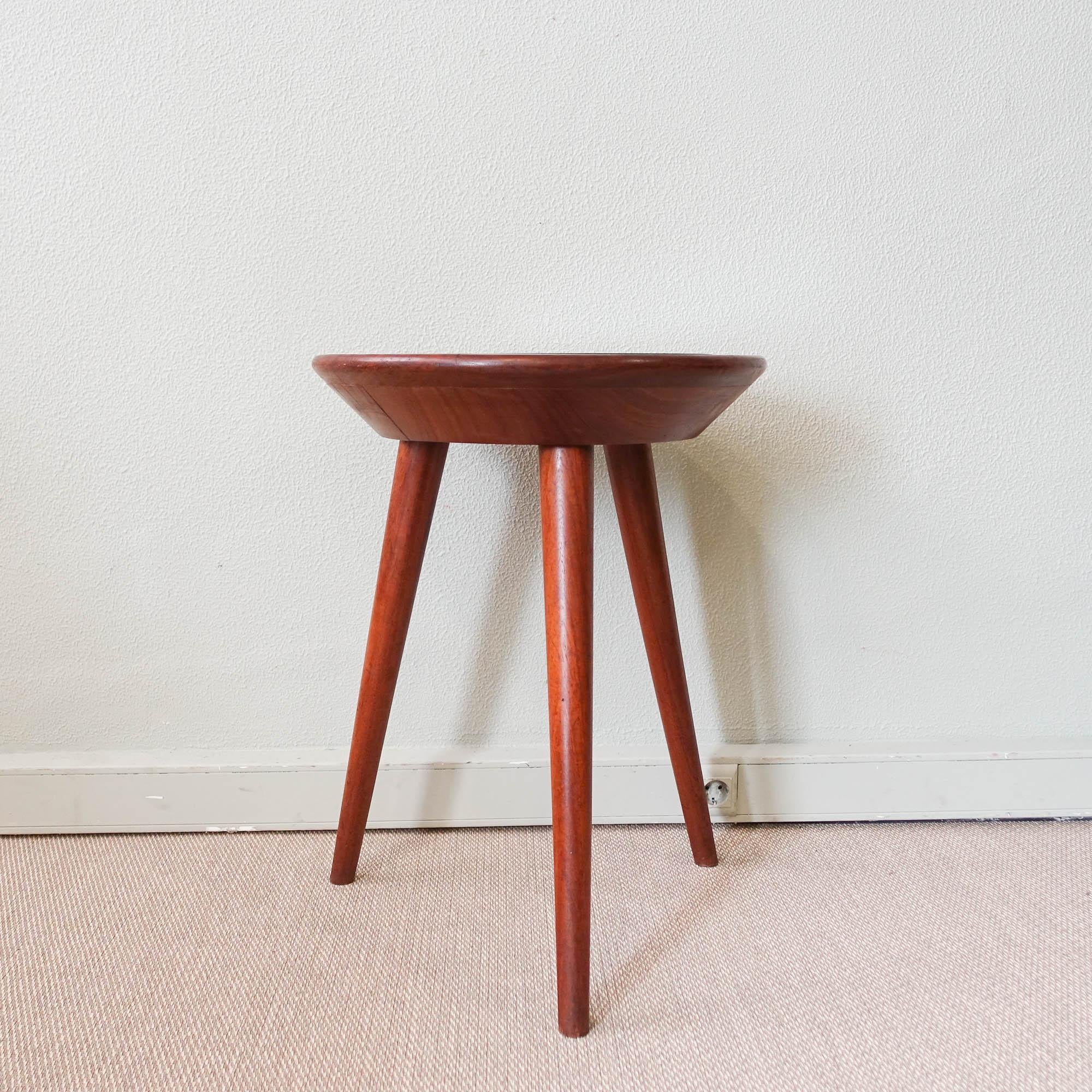 This coffee table was designed and produced by Altamira in Portugal, during 1950's. This is an unusual and unique design, in Gio Ponti style.The three leg structure and top are made of solid mutenye wood. The table top has an inset, with fabric and