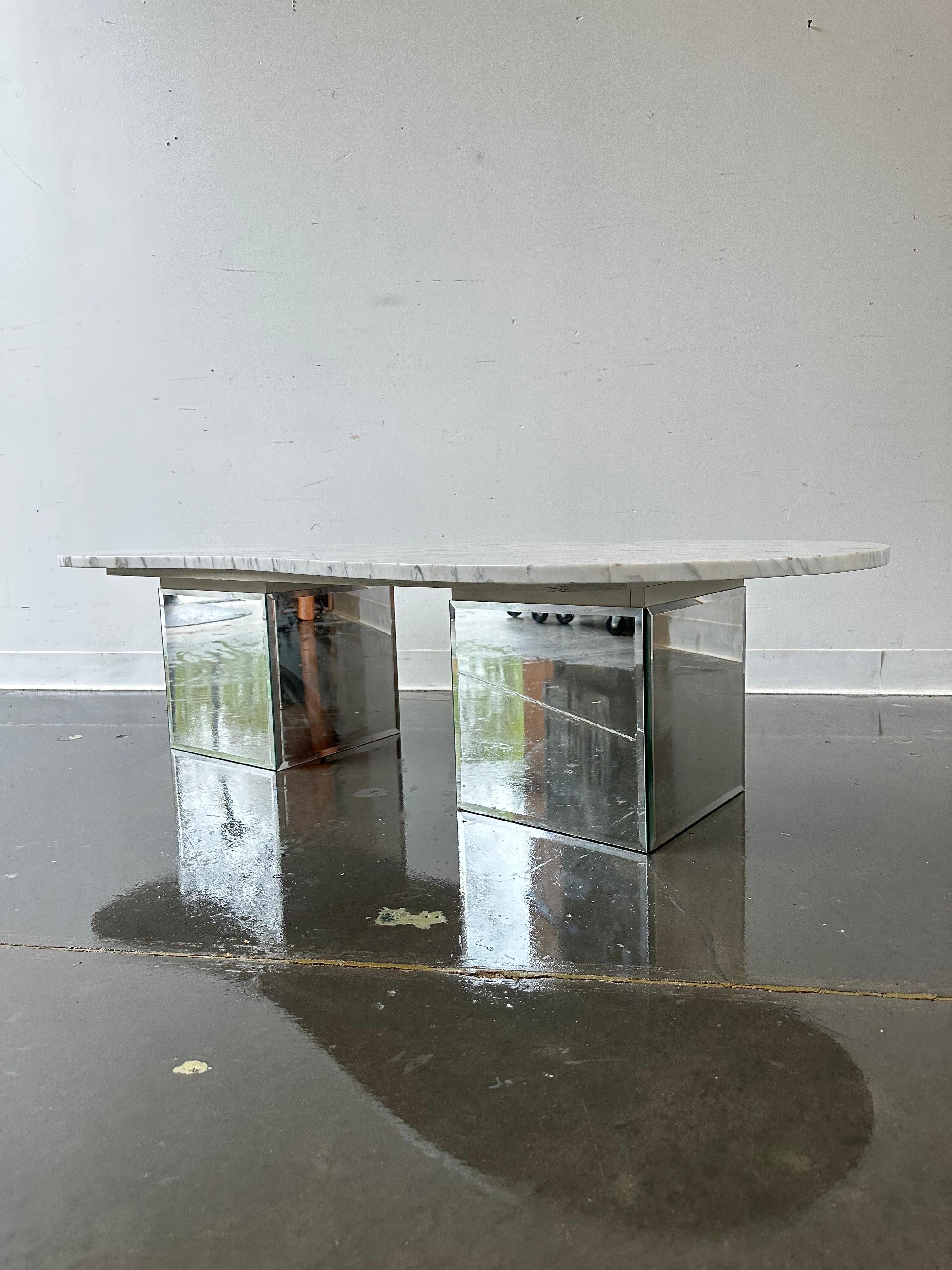 Vintage post mod kidney shaped marble top table with glass base 

Fabulous piece in excellent condition with minor signs of wear ( very light scratches to marble ) 

Dimensions:

25” deep at one end 
17” deep at narrow end 
59” L
14 1/2” H.