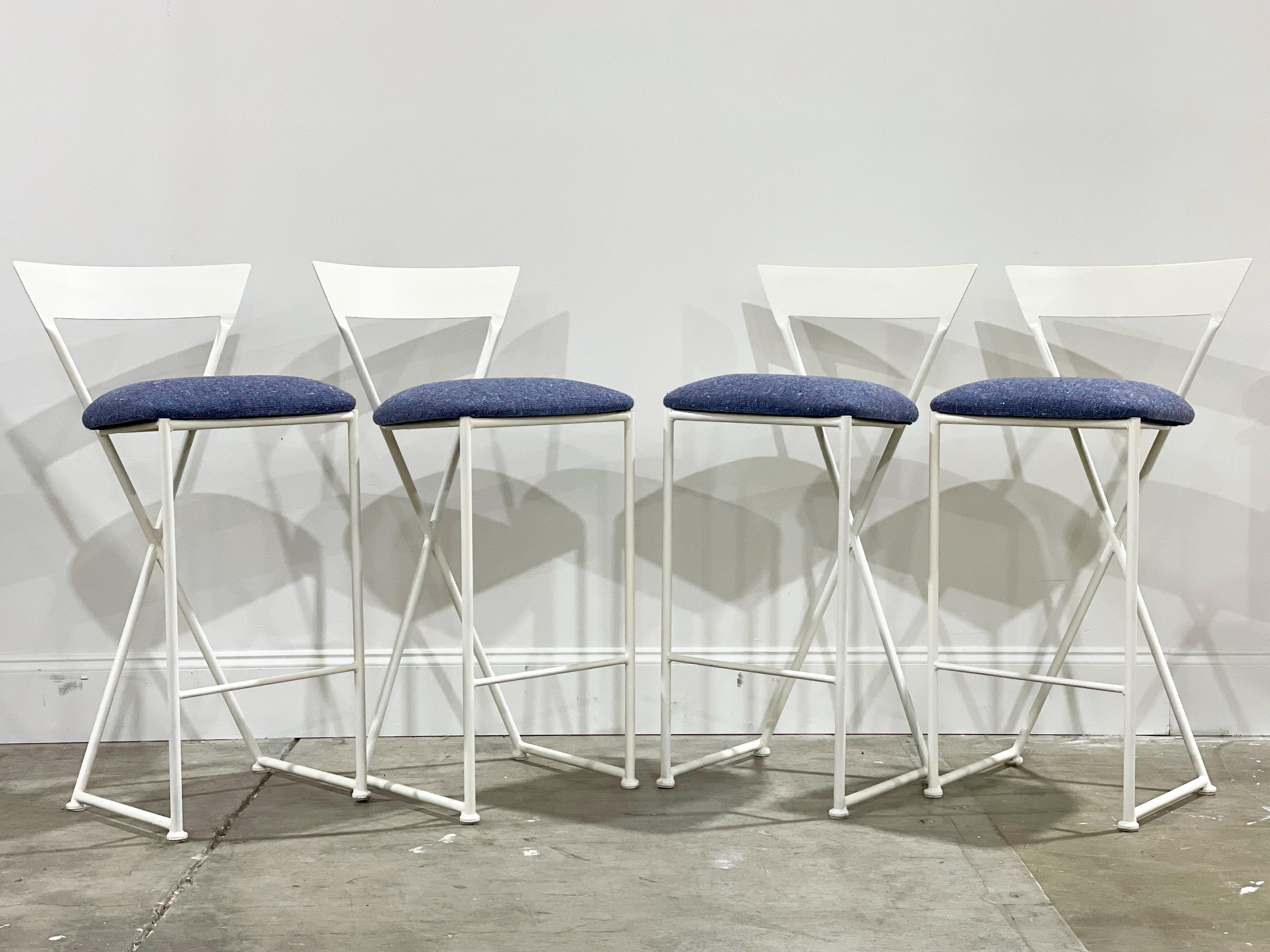Rare post modern bar stools by Shaver Howard. Bar height. Stark clean angles offset by soft creamy off white lacquer and indigo tone Maharam tweed. This set of four is unique on the market. The stools are in excellent condition. Freshly lacquered in