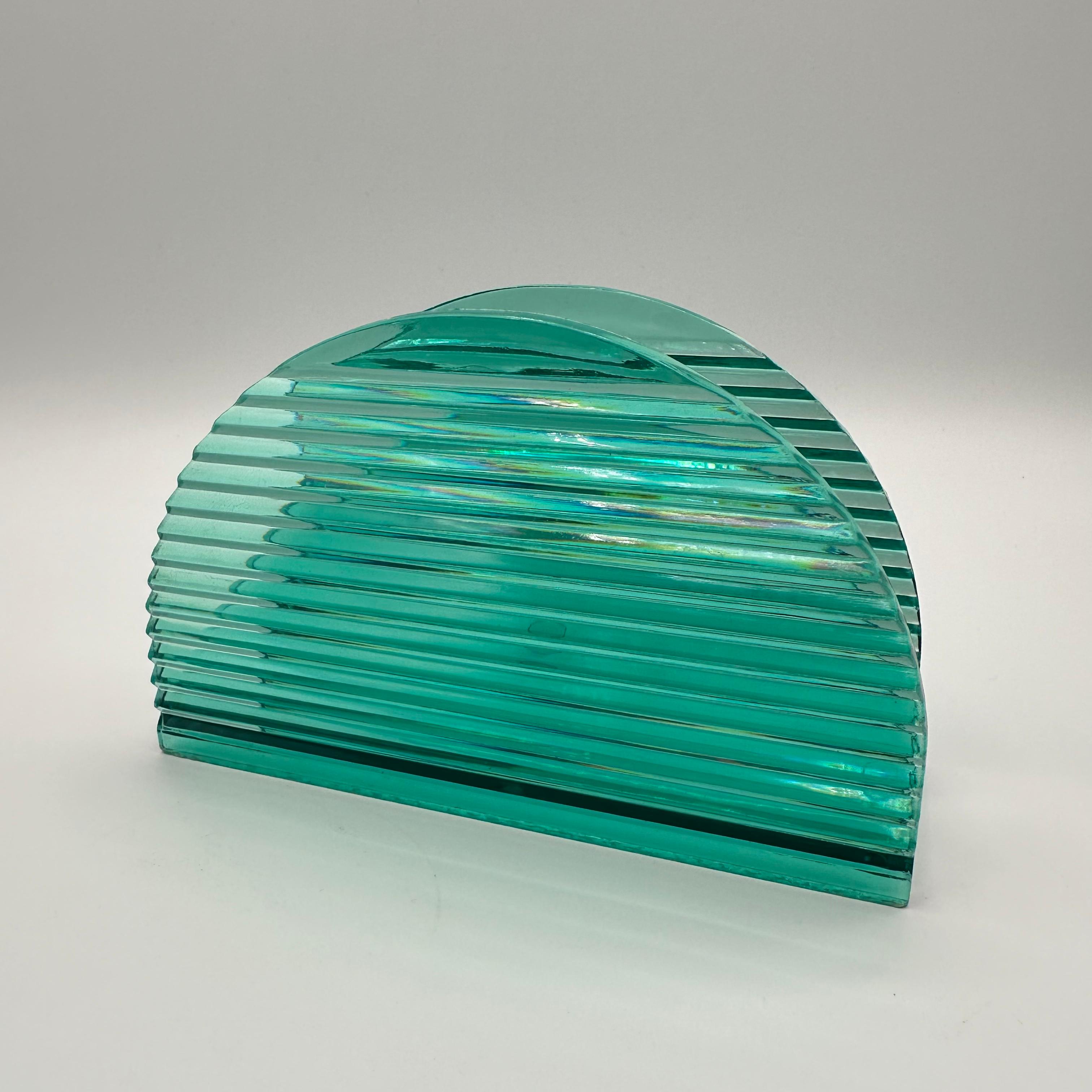 A vintage post modern napkin holder in a teal or aqua bluegreen color. With a dome or half moon shape, along with a pyramidal fluted horizontal rib detail. 