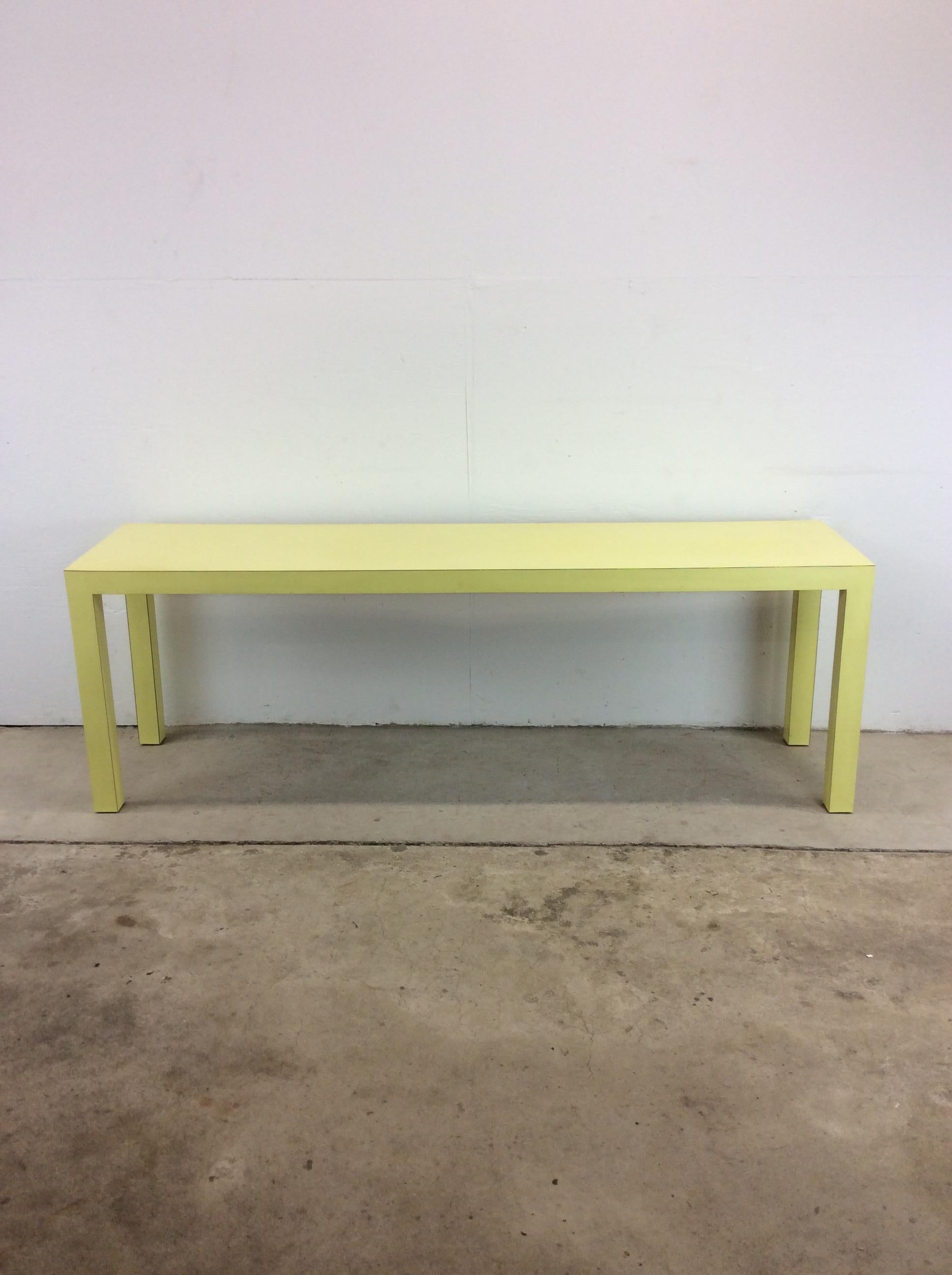 This vintage post modern sofa / console table features pressed wood construction, unique key-lime green lacquer finish, long smooth top, four squared legs, with lacquer finish throughout.

Complimentary pair of side green side chairs available