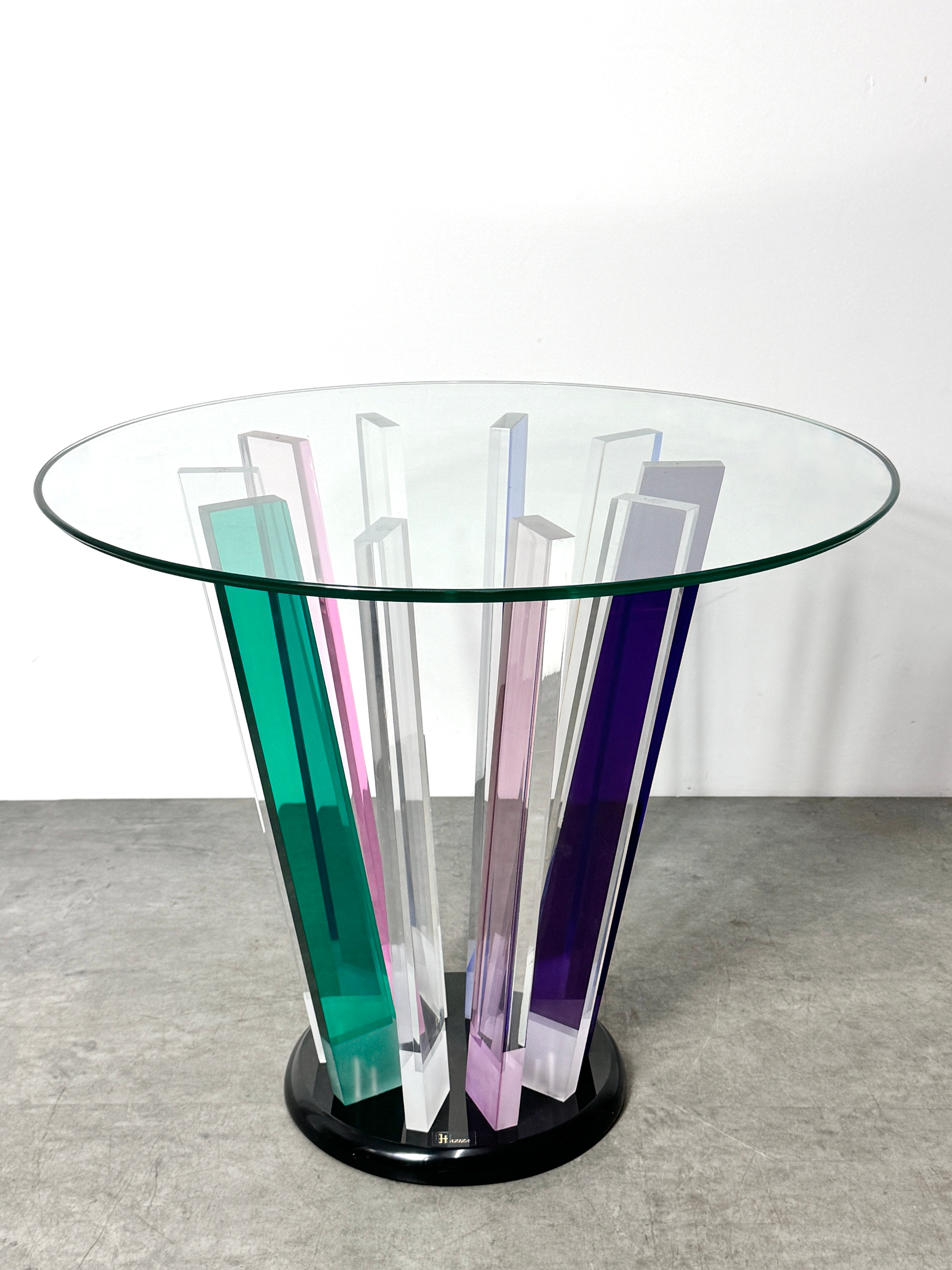 Sculptural Lucite and glass end table by Israeli artist Shlomi Haziza circa 1990s

Unique contemporary piece with multi color prismatic base topped with round glass  

Original signature label intact

20.5 inch diameter
24 inch height