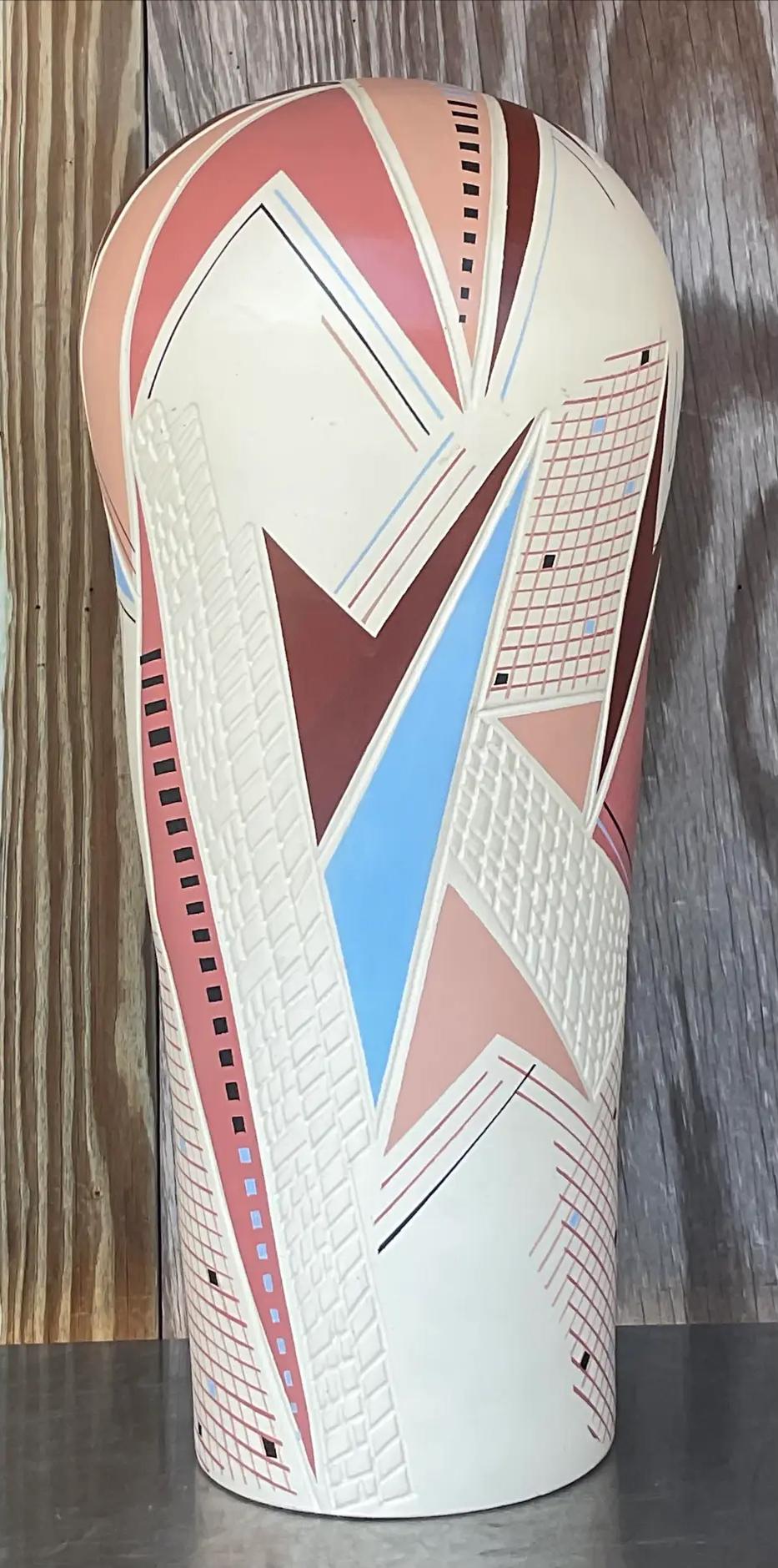 Elevate your space with our Vintage Post-Modern Signed Hand-Painted Tall Vase, a striking fusion of artistic flair and American design. Crafted with meticulous attention to detail and signed by the artist, this vase embodies the spirit of
