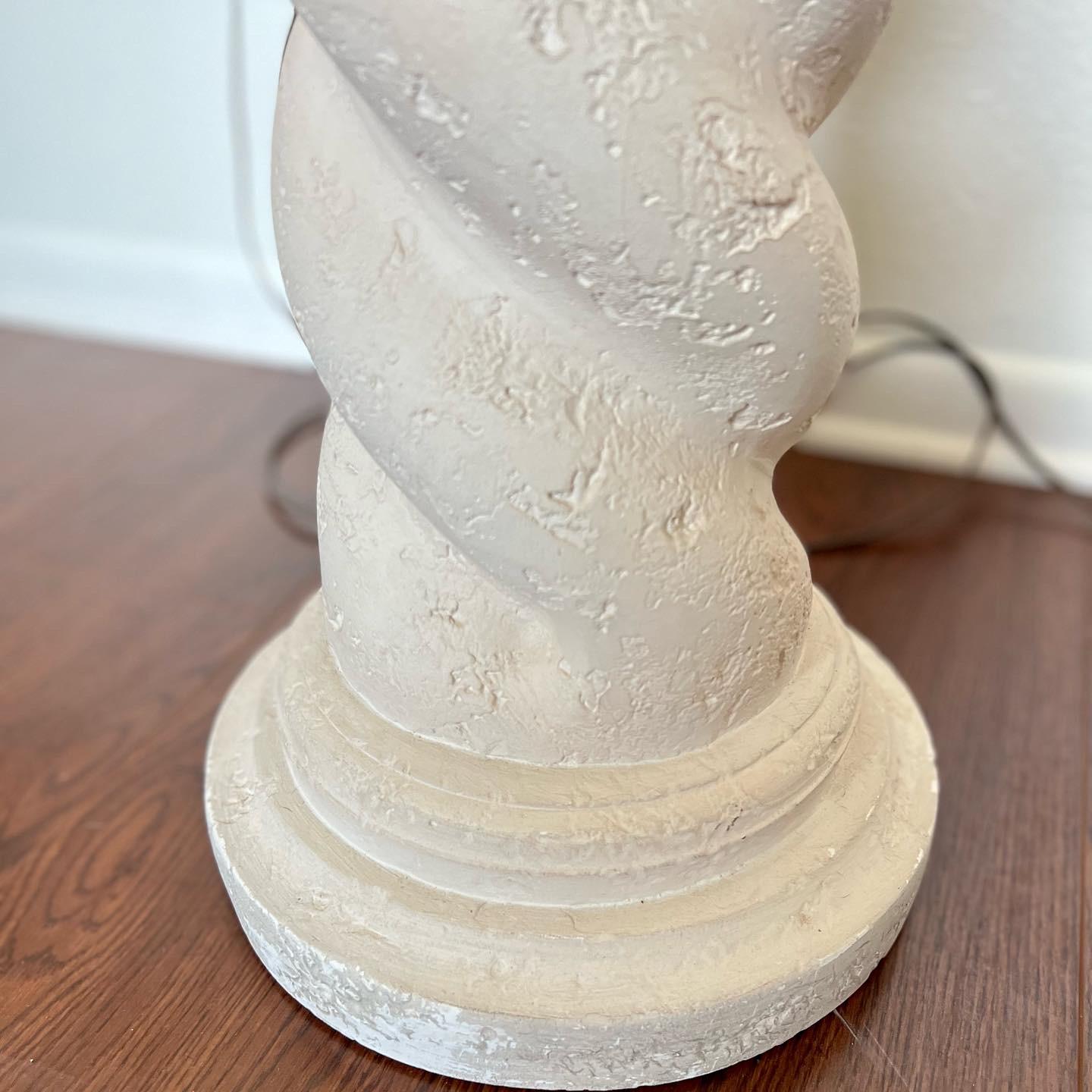 Vintage Michael Taylor style spiral plaster floor lamp and table lamp. Circa 1980's. Chunky textural plaster spiral lamps with original empire shades. Shades are a bit discolored and have some cracks. Plaster is a natural off white color, and in