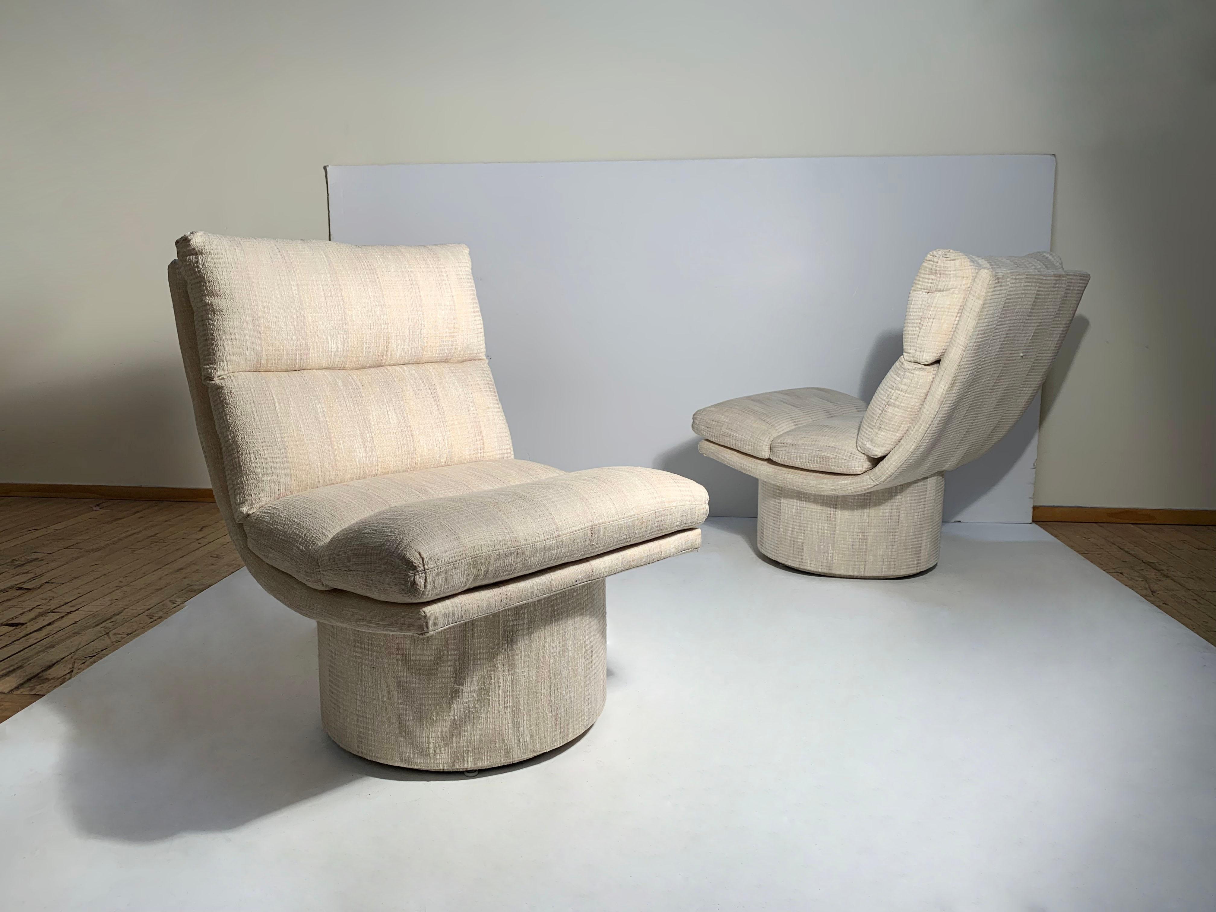 Vintage Post Modern swivel lounge scoop chairs by Classic Gallery.

These can use reupholstery. One of them needs tightening with the swivel mechanism that should be handled when reupholstering. These would look great with a wrapped wood veneer or