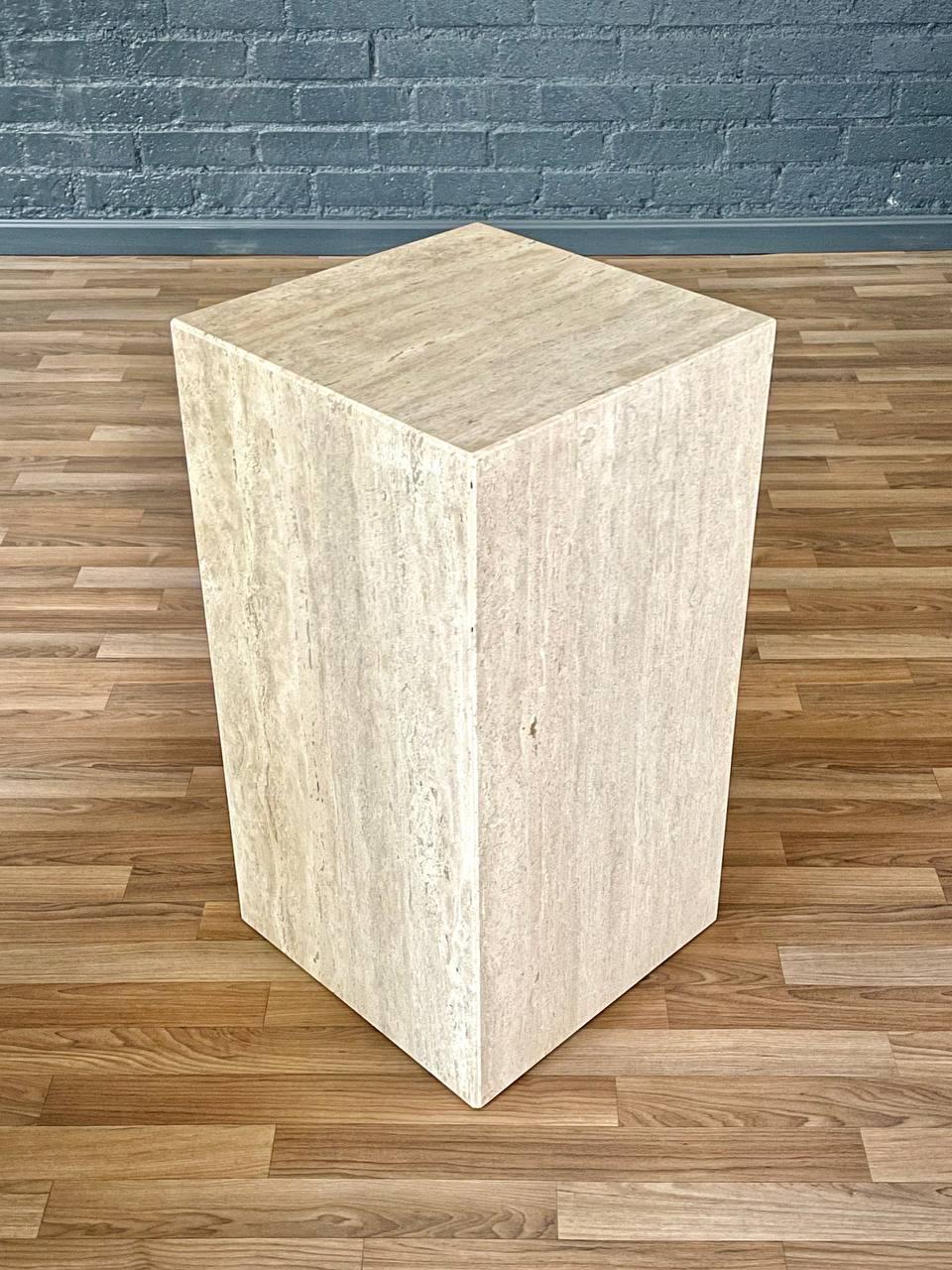 Condition: Original Vintage Condition
Materials: Italian Travertine Stone

Crafted in Italy during the 1970s, this striking pedestal table is made from solid Italian travertine stone and embodies the clean, geometric lines of Postmodern design. The