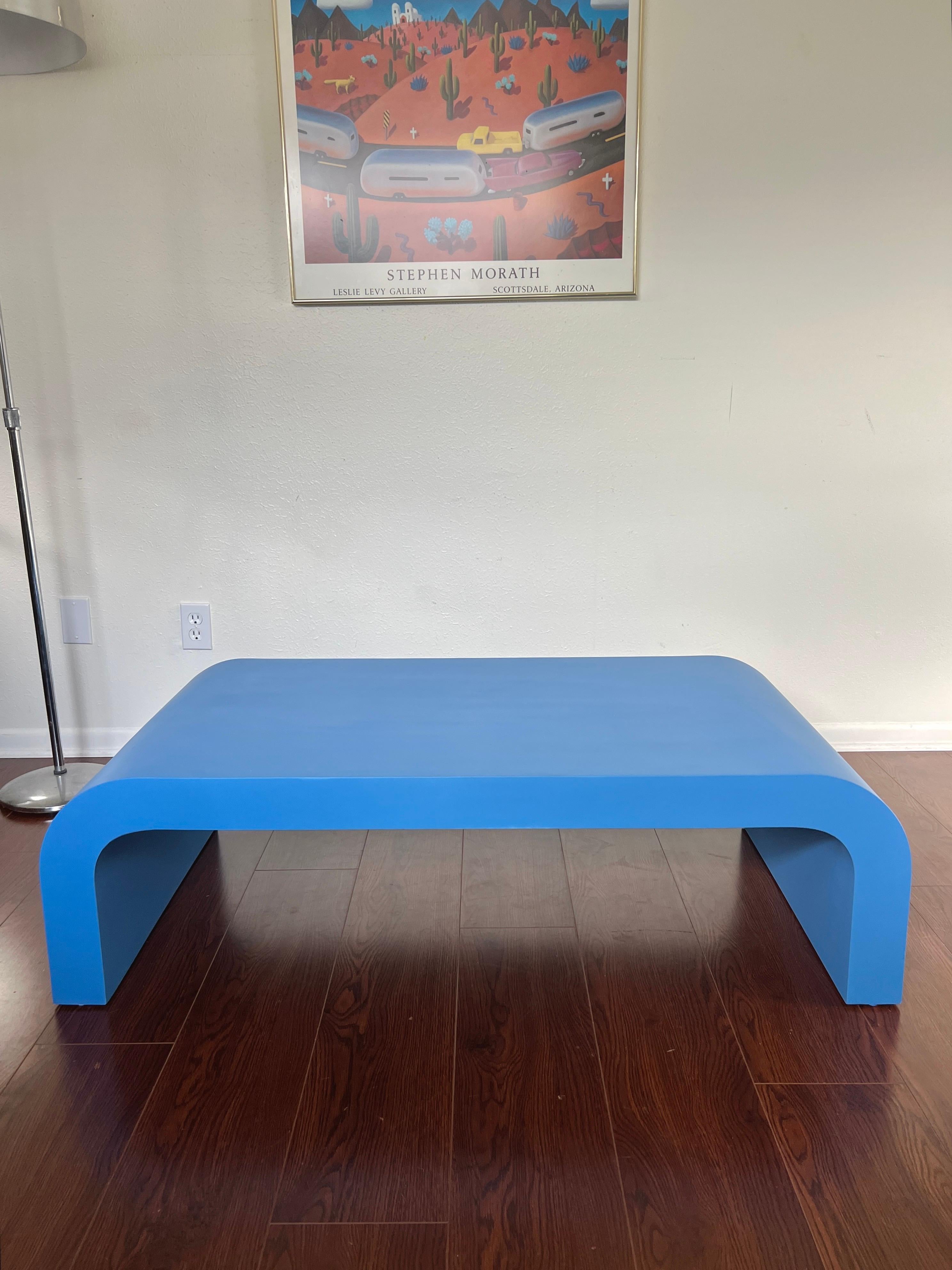 Vintage post modern waterfall coffee table in a gorgeous blue color. This waterfall design remains timeless with replicas all over the internet. Would look stunning in any home and compliment both vintage and modern styles. Recently refinished and