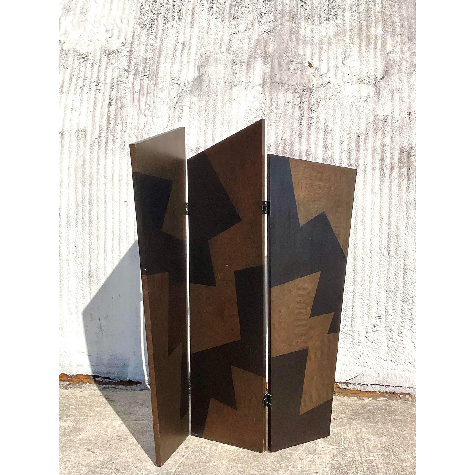 Fantastic vintage Angled wood room divider. Monumental in size and drama. Large spikes with a zig zag design in black and gold. Acquired from a Palm Beach estate.
