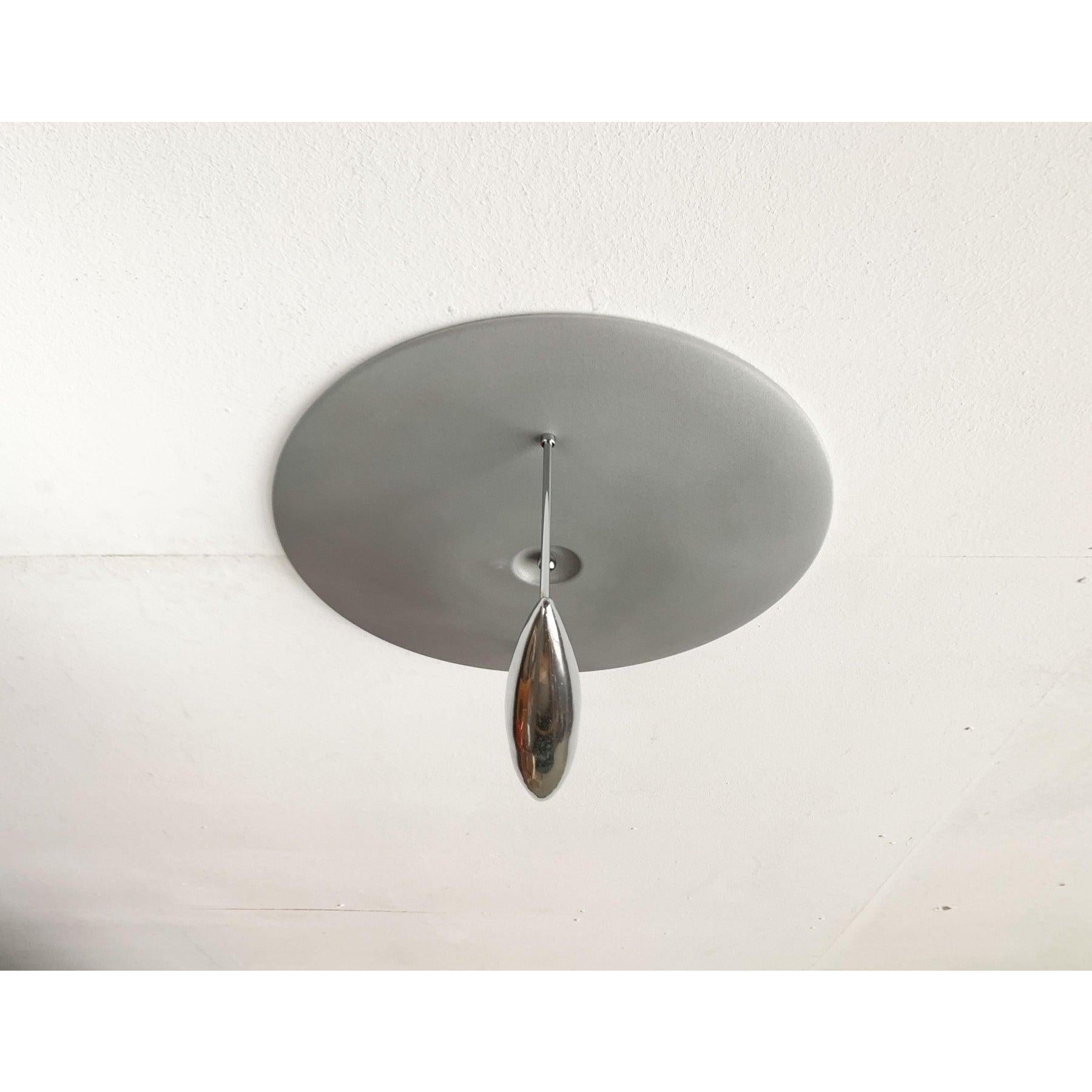 Elegant ceiling light from the Spanish manufacturer B.Lux after a design by Jorge Pensi from the late 1980s.

A postmodern design. This lamp convinces with its elegant design language and the special materiality. At the end of two bridges, a boat