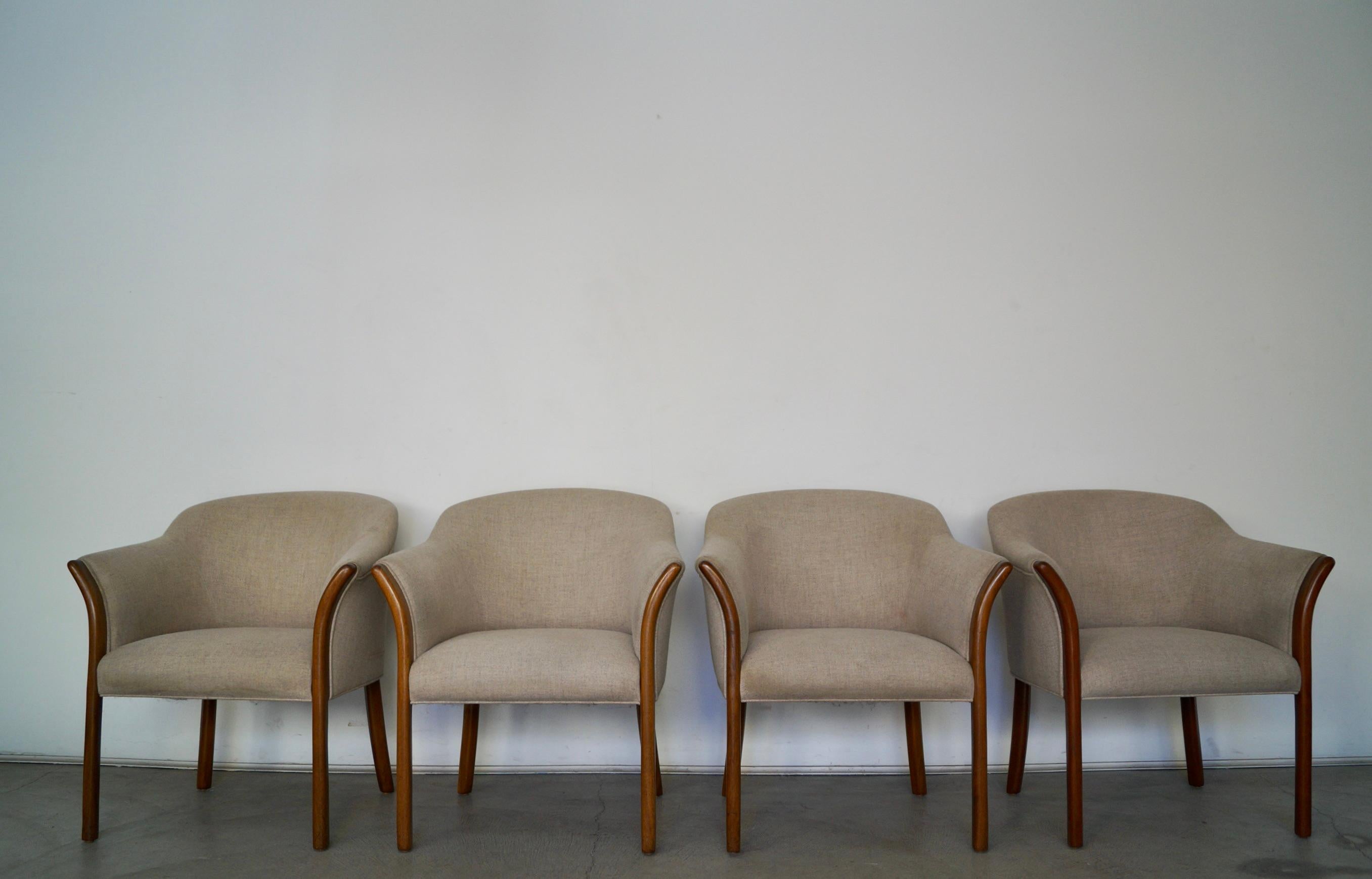 Vintage Post Modern armchairs for sale. Very beautiful design with solid walnut arms and legs. The arms have a nice design and are bent outwards. They have a barrel back shape, and have webbing in the seats. These chairs are really well made, and