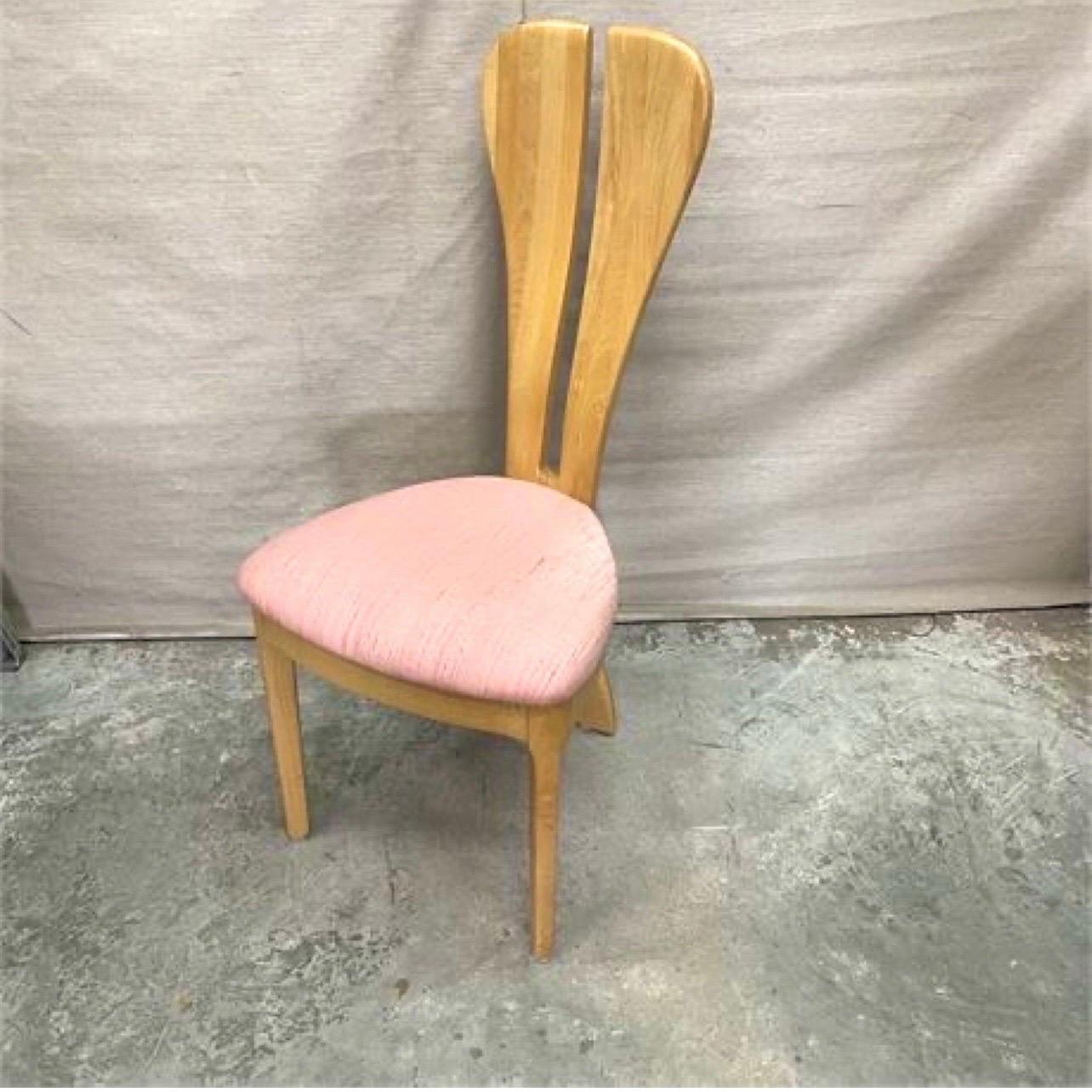 This chair is so sexy that I think I could find a spot for it in any room of the house. And the fabric on the seat cushion is easy to change to fit your decor. (Because maybe pink is not your color?). This rabbit ear chair with the split back leg is
