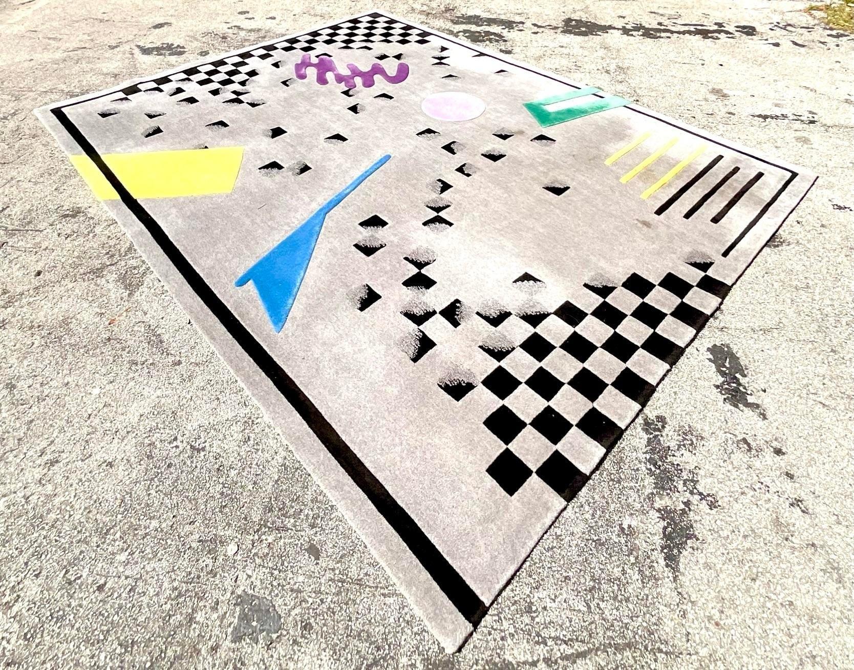 A vintage postmodern Edward Fields geometric rug, known for its bold, angular patterns and vibrant color contrasts. This rug showcases the hallmark design of Fields, blending postmodern aesthetic with intricate craftsmanship. Its eye-catching