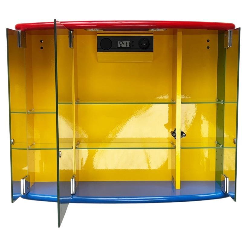 Postmodern design bathroom cabinet from the French manufacturer Decotec.

A postmodern eye-catcher that impresses with its colors and functionality. The different surfaces of the cabinet are alternately decorated in red, blue, yellow and green. The
