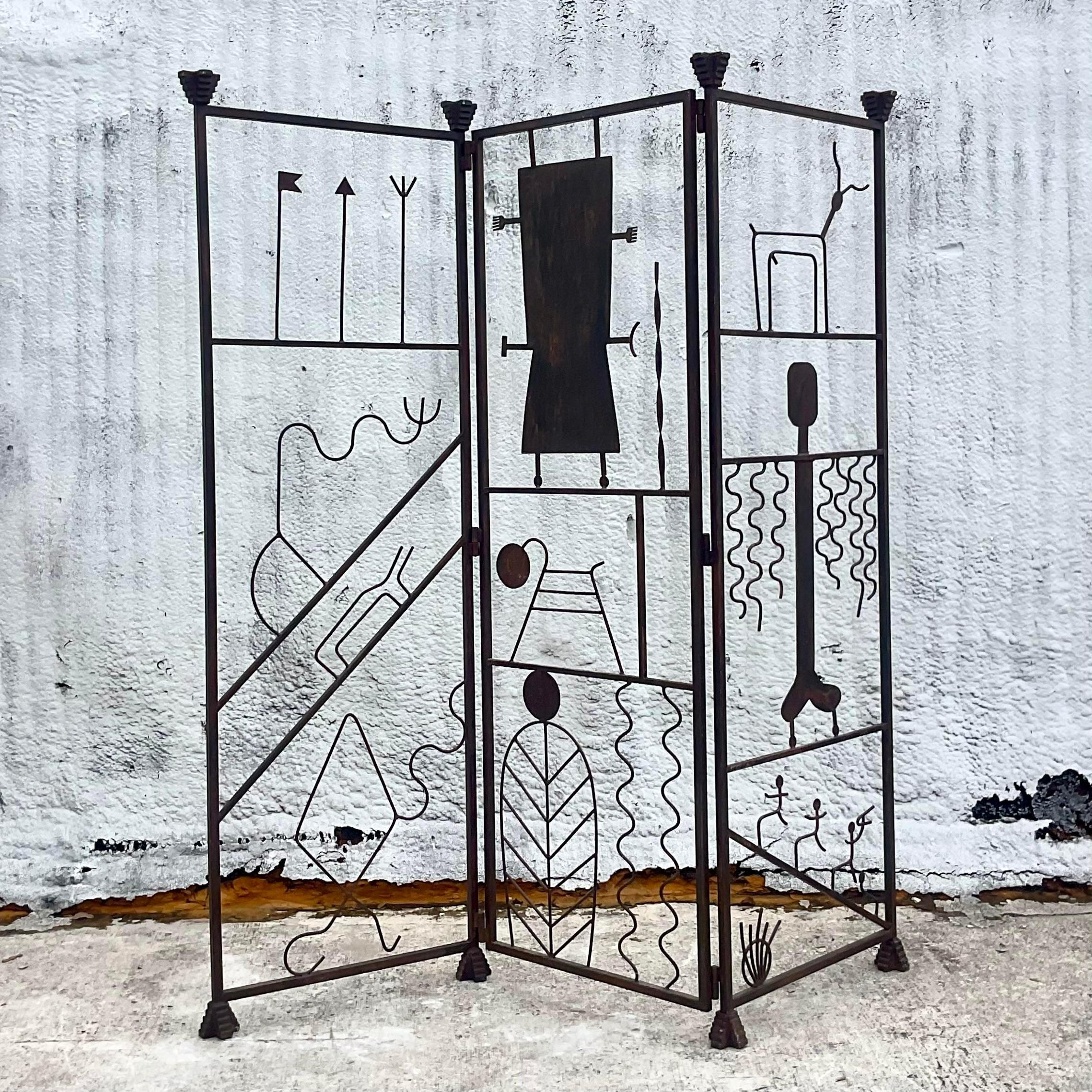 Make a bold statement with this Vintage Postmodern Hieroglyphic Wrought Iron Screen, an iconic fusion of art and functionality emblematic of American design innovation. Crafted with intricate hieroglyphic motifs, this screen channels the spirit of