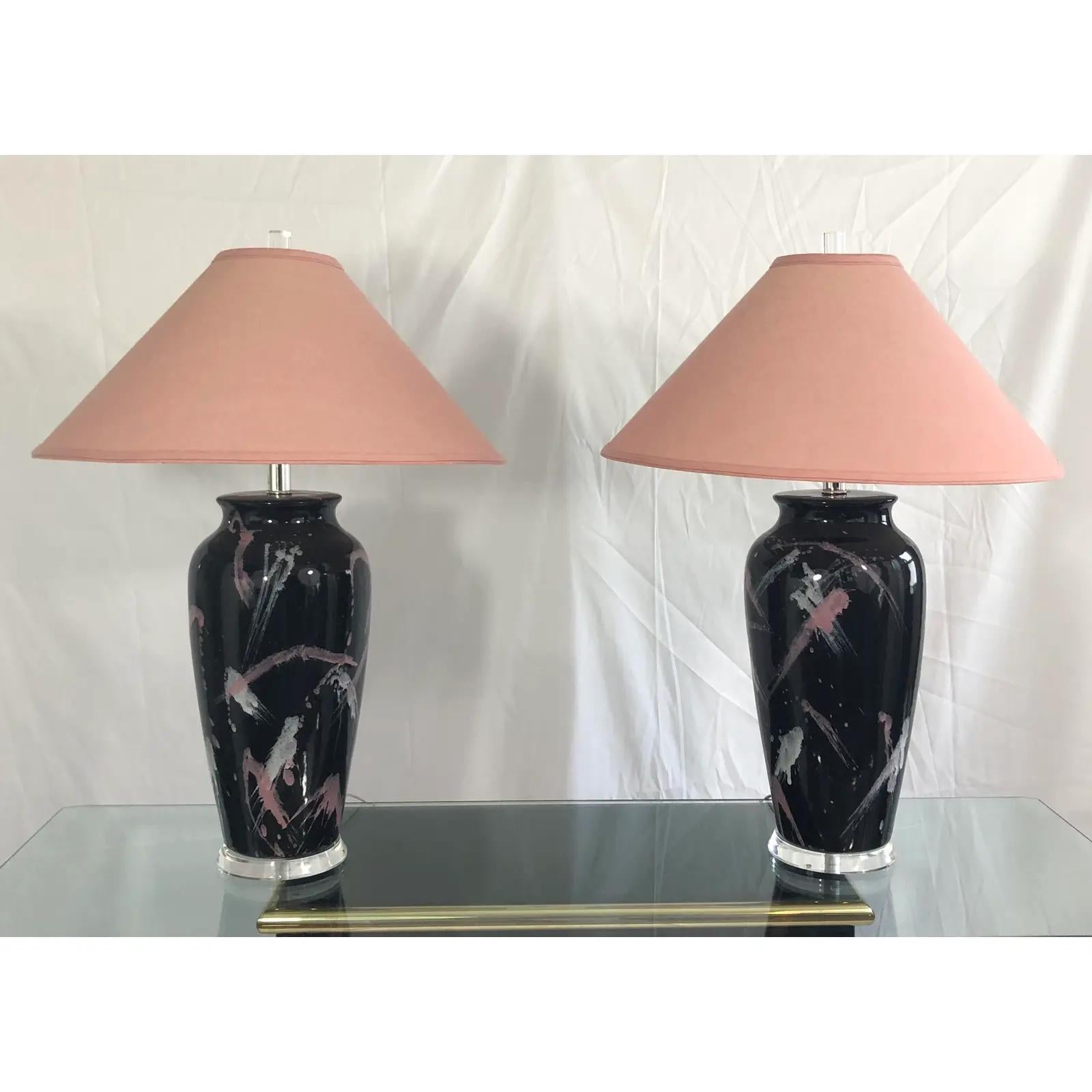 Pair of vintage, pink and white graphic splatter glaze over black finish table lamps in the style of Jackson Pollock. Height to top of socket is approx. 20