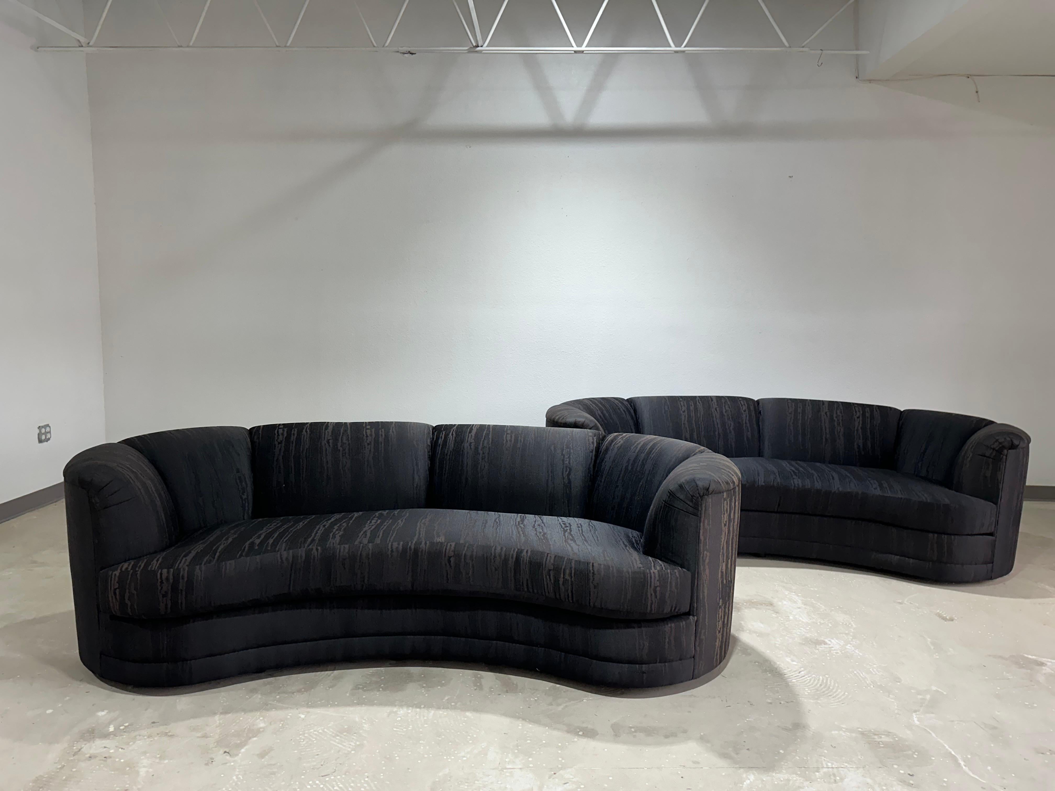 Vintage Post Modern Curved Kidney Bean Shaped Sofa in black Miore pattern fabric with channel tufted back c.1980’s. 

Beautiful post mod sofa with subtle curved shape upholstered in black moire watermark faux silk fabric. Clips on cushion backs to