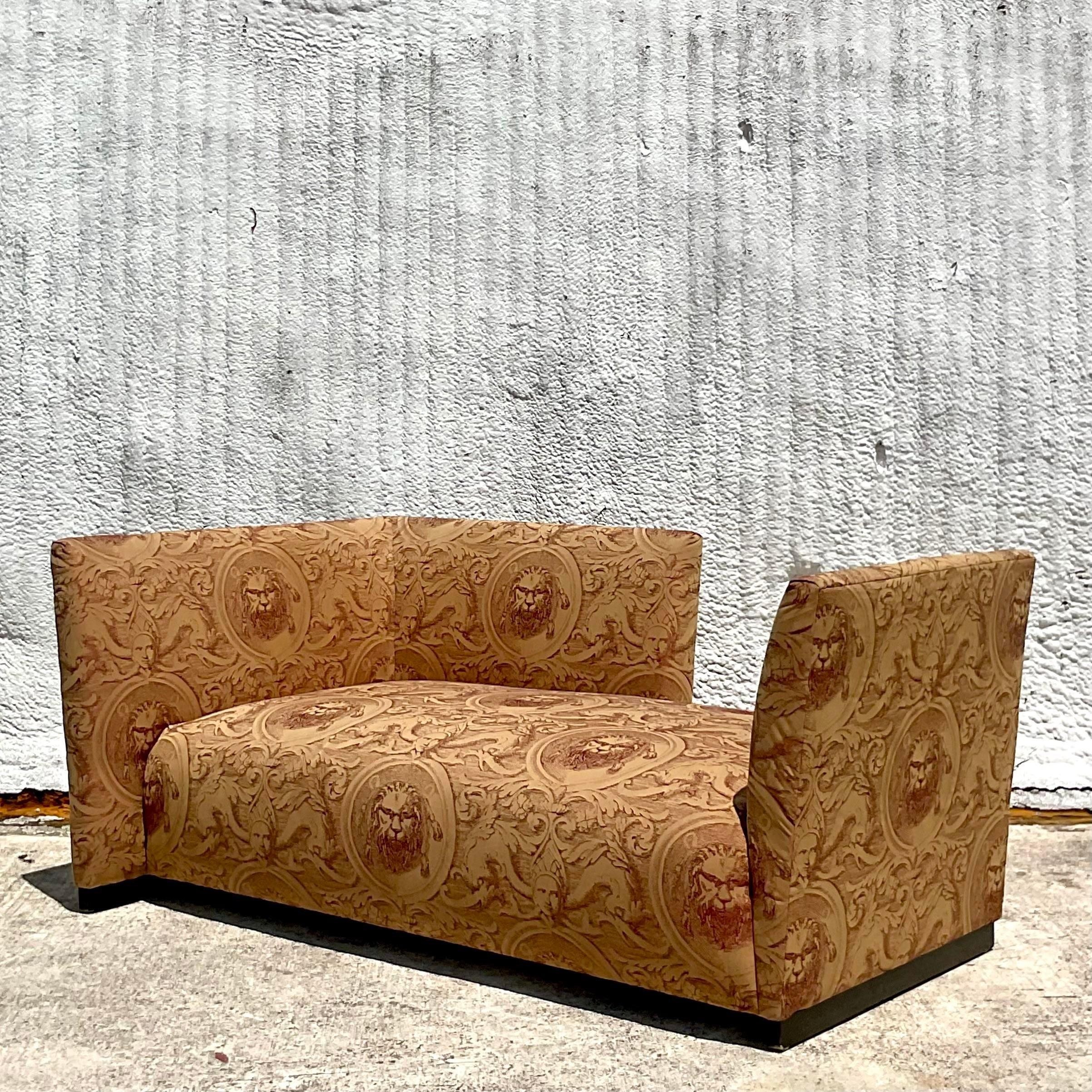 A fabulous vintage Postmodern chaise. A classic Tete A Tete sofa with high backs on each end. A perfect place to curl up and read a book. A chic lions head printed jacquard upholstery. Acquired from a Palm Beach estate.