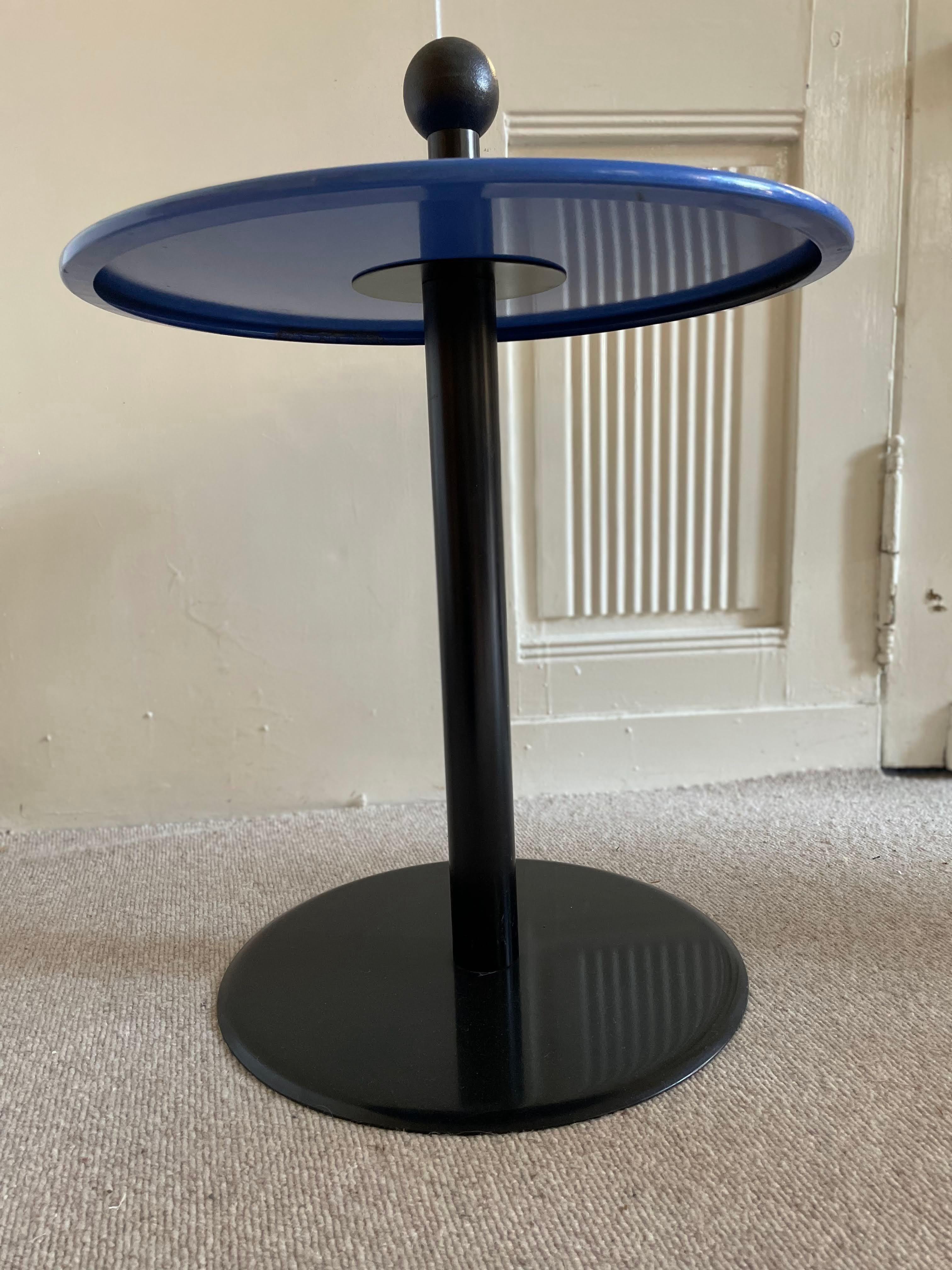 Postmodern side table from the 1980s. The ball at the top makes it easy to move the table with one hand.

The table is made of lacquered steel. The handle ball is made of plastic.

Dimensions: Diameter 51 cm, height 65 cm.