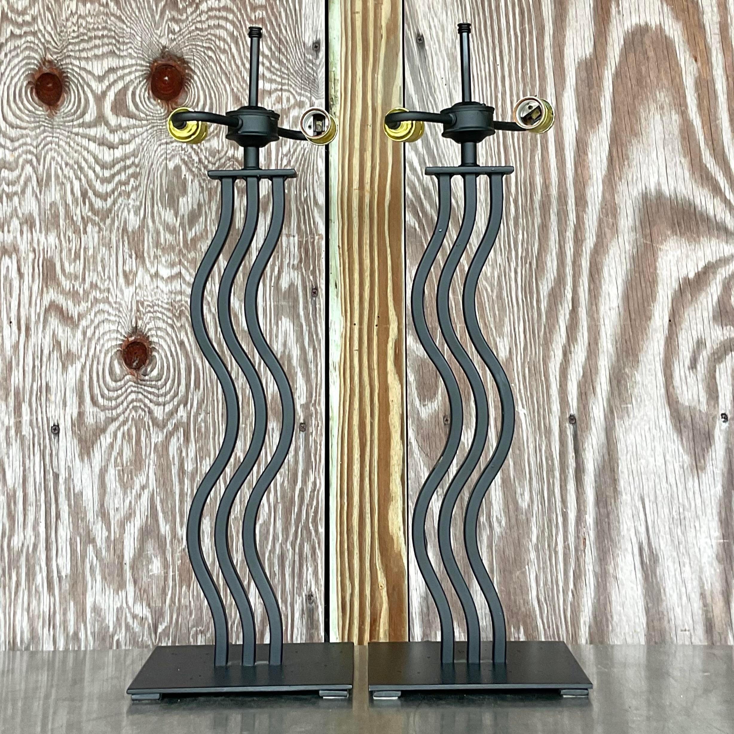 A fantastic pair of vintage Postmodern table lamps. The coveted Memphis style wave in a black metal. Acquired from a Palm Beach estate.