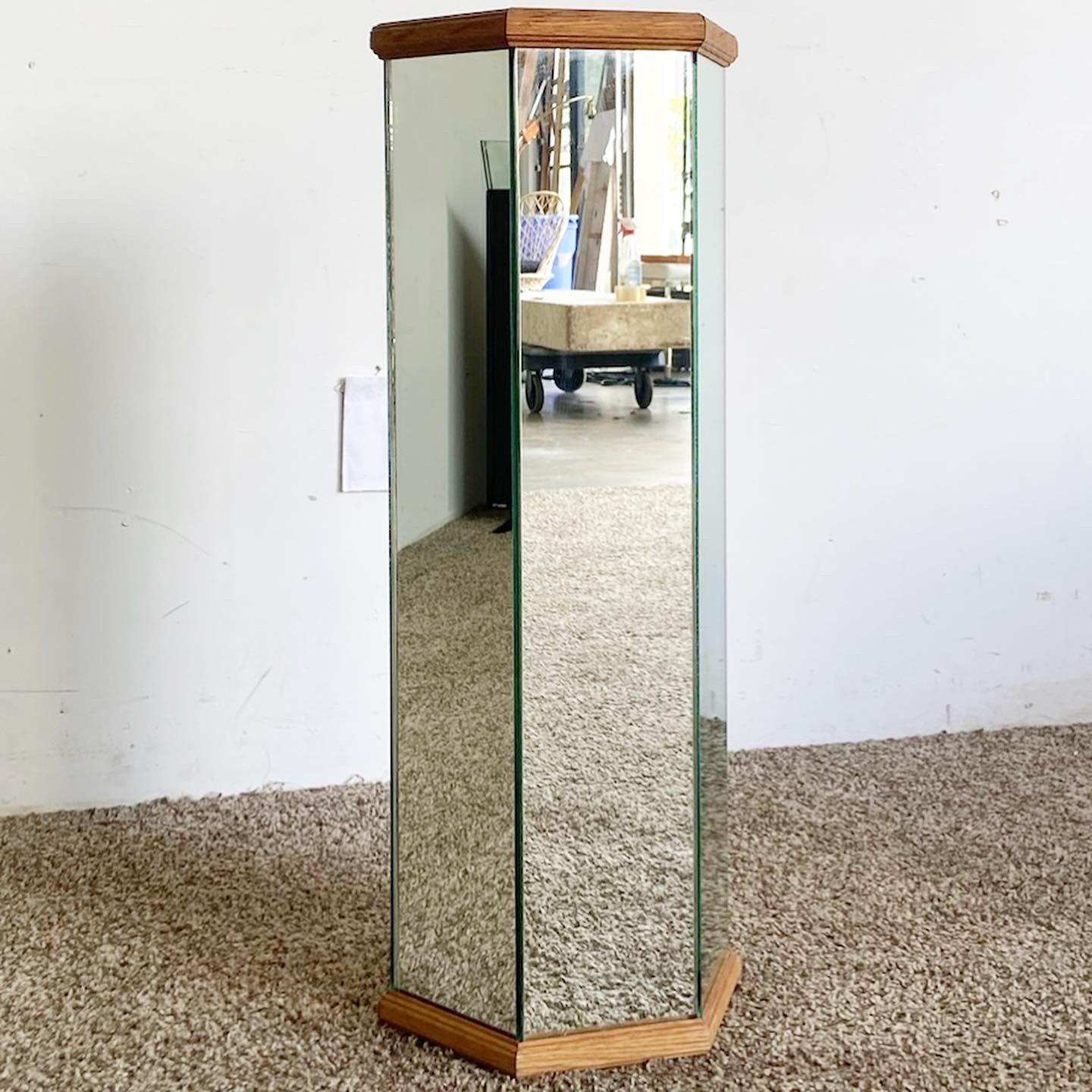 Elevate your space with our wonderful vintage postmodern hexagonal pedestal. It showcases mirrored sides and top, complemented by wooden framing around the top and bottom for a distinctive touch.


    Vintage postmodern hexagonal pedestal
   