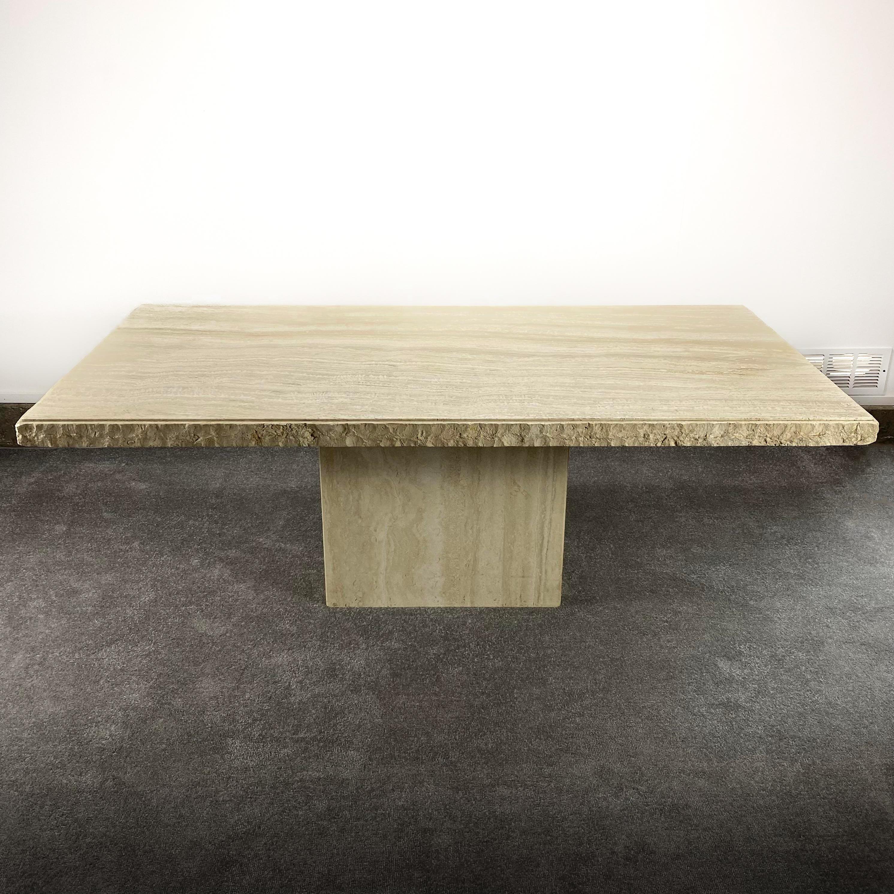 Solid raw edge travertine dining table now available. Measures approximately 79 x 39.75 x 29.5 T. In In excellent condition. Features 