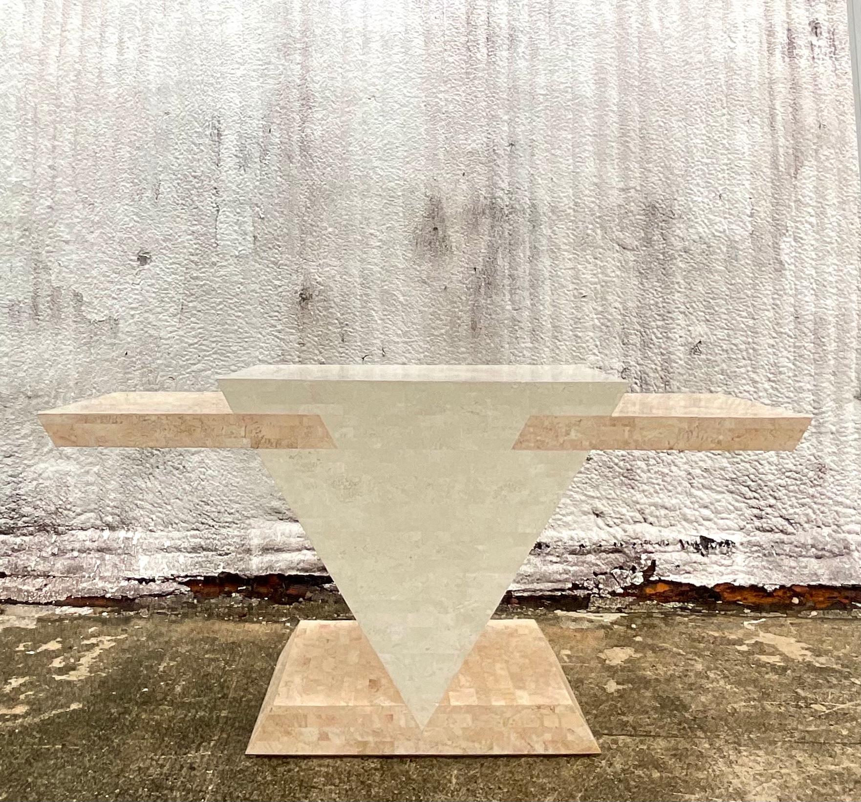 Fantastic vintage Postmodern credenza. Beautiful two tone tessellated stone in a chic angular shape. A striking statement piece. Acquired from a Palm Beach estate.